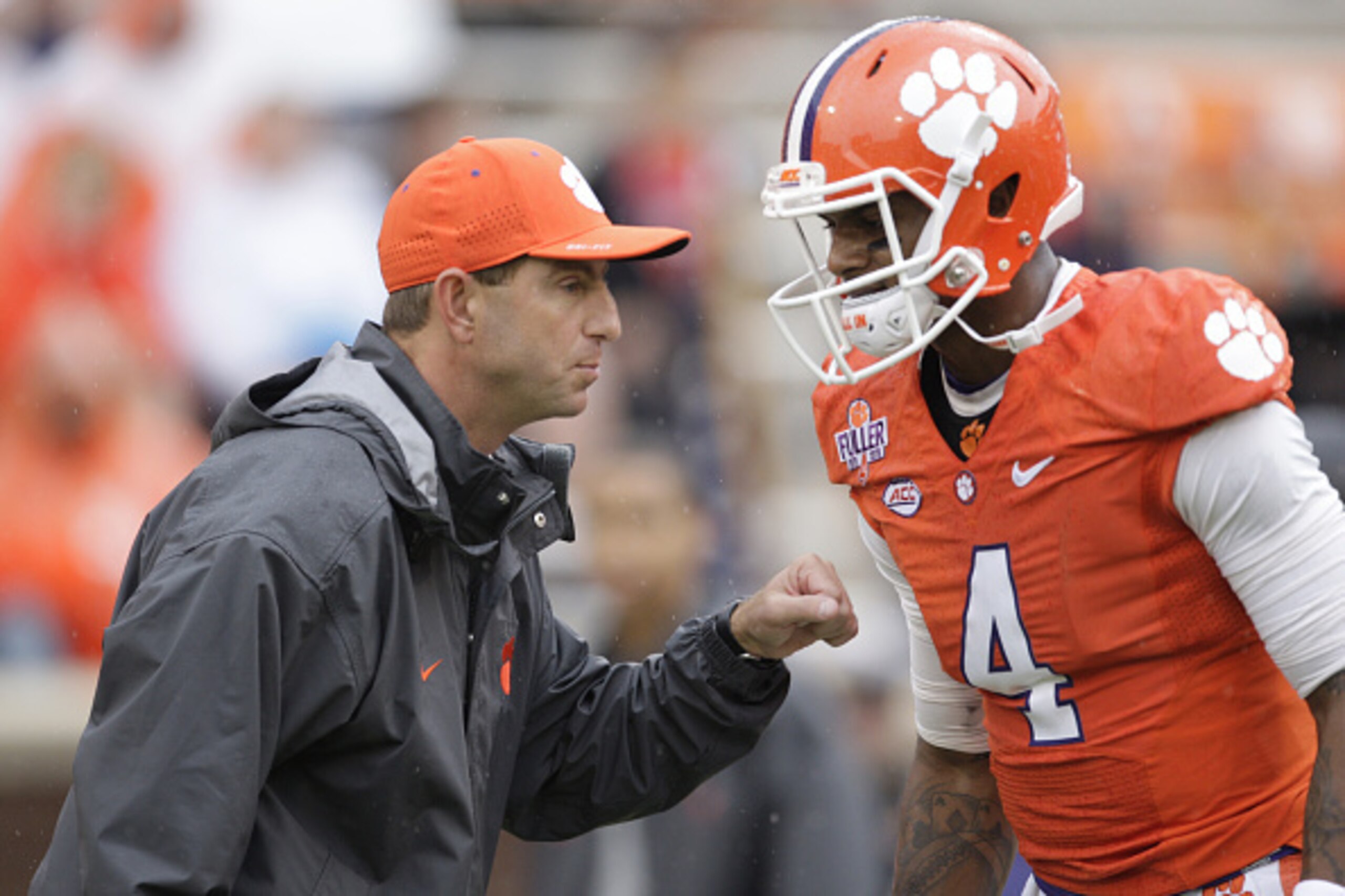 CLEMSON, SC - OCTOBER 10: Head Coach Dabo Swinney of the Clemson Tigers talks with quarterback Deshaun Watson #4 prior to their game against the Georgia Tech Yellow Jackets at Memorial Stadium on October 10, 2015 in Clemson, South Carolina. (Photo by Tyle