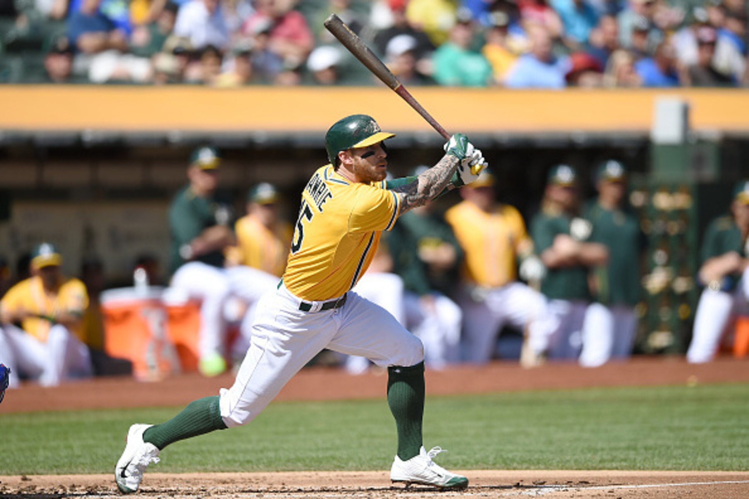 OAKLAND, CA - SEPTEMBER 24:  Brett Lawrie #15 of the Oakland Athletics bats against the Texas Rangers in the bottom of the first inning at O.co Coliseum on September 24, 2015 in Oakland, California.  (Photo by Thearon W. Henderson/Getty Images)