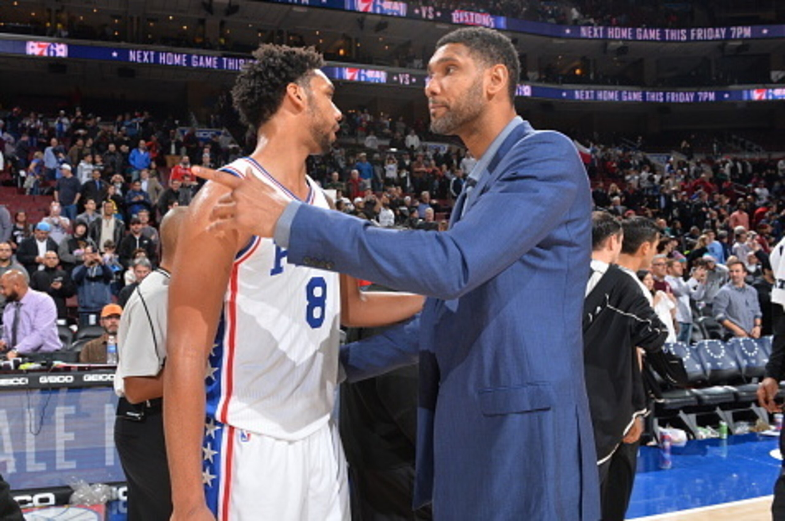PHILADELPHIA,PA - DECEMBER 7:  Jahlil Okafor #8 of the Philadelphia 76ers hugs Tim Duncan #21 of the San Antonio Spurs at Wells Fargo Center on December 7, 2015 in Philadelphia, Pennsylvania NOTE TO USER: User expressly acknowledges and agrees that, by do