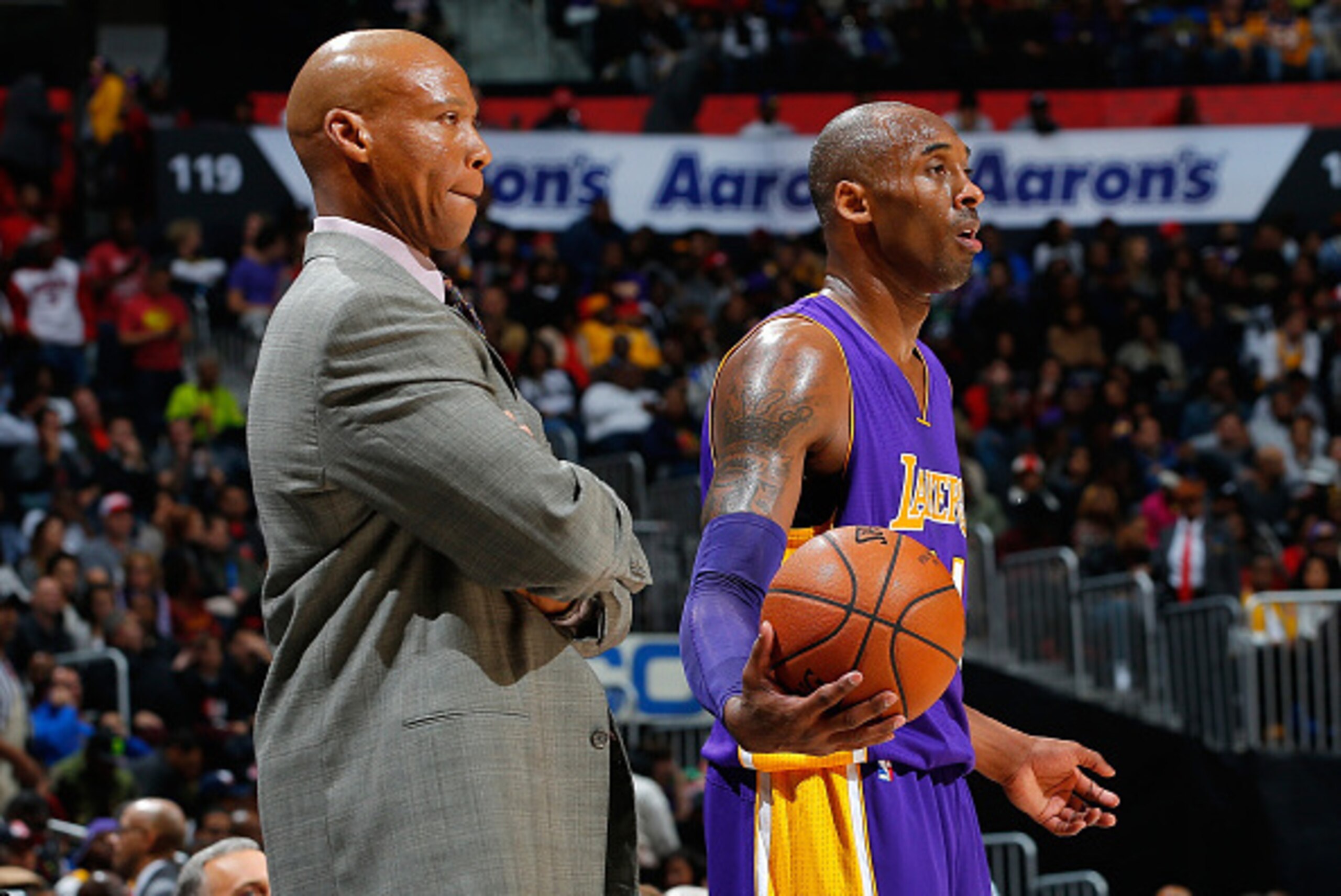 ATLANTA, GA - DECEMBER 04:  Byron Scott of the Los Angeles Lakers looks on as Kobe Bryant #24 prepares to inbounds the ball against the Atlanta Hawks at Philips Arena on December 4, 2015 in Atlanta, Georgia.  NOTE TO USER User expressly acknowledges and a