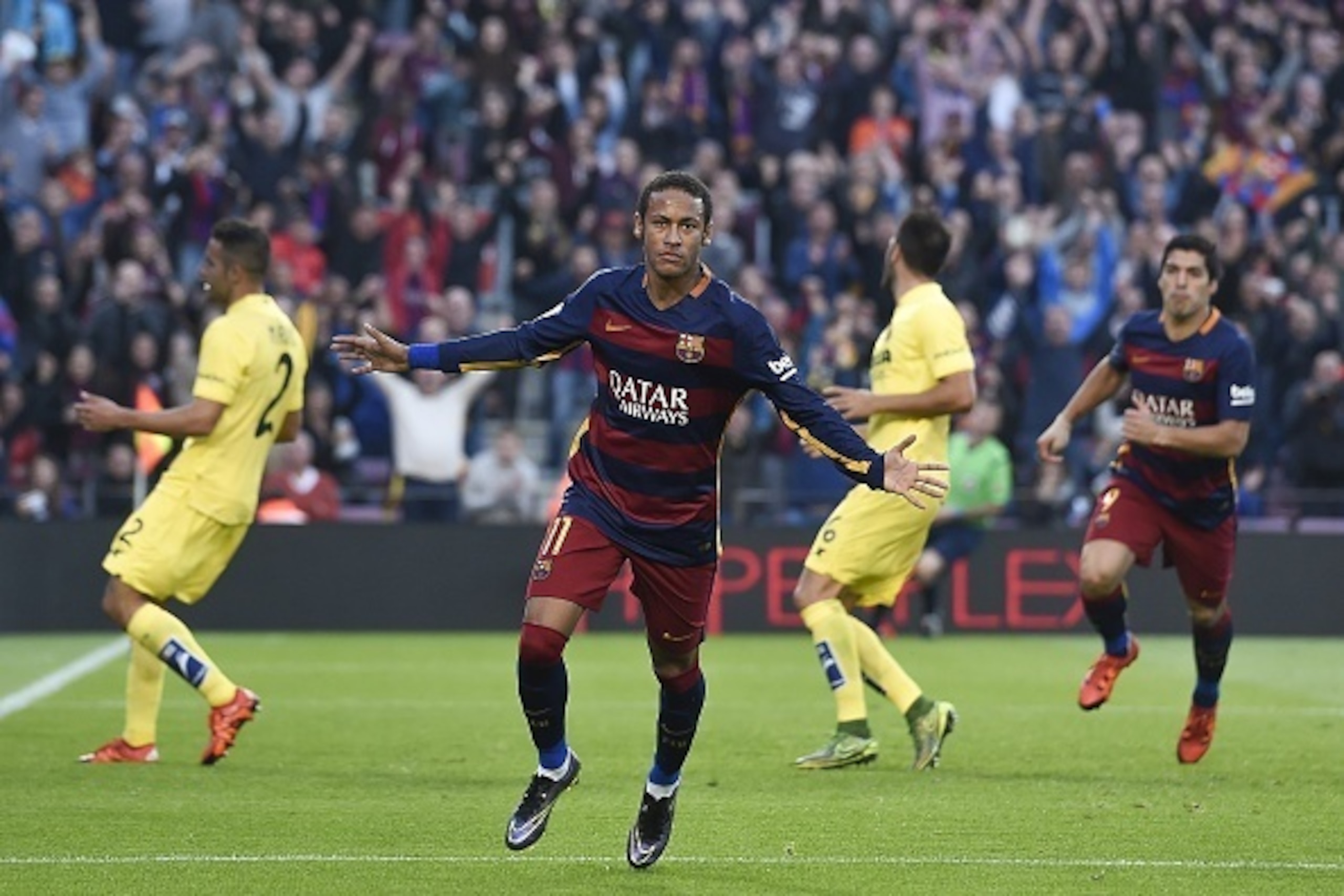 Barcelona's Brazilian forward Neymar da Silva Santos Junior (C) celebrates his goal during the Spanish league football match FC Barcelona vs Villarreal CF at the Camp Nou stadium in Barcelona on November 8, 2015.   AFP PHOTO/ JOSEP LAGO        (Photo cred