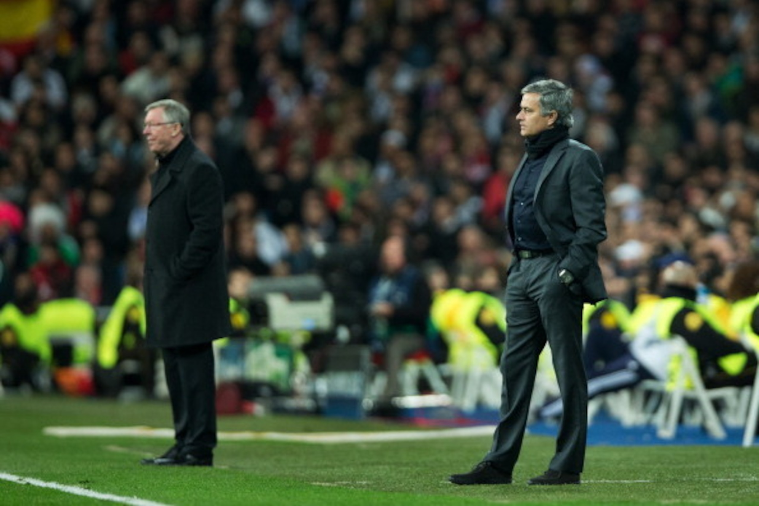 MADRID, SPAIN - FEBRUARY 13: Head coach Jose Mourinho (R) of Real Madrid stands besides Sir Alex Ferguson, manager of Manchester United, during the UEFA Champions League Round of 16 first leg match between Real Madrid and Manchester United at Estadio Sant