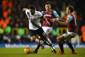LONDON, ENGLAND - NOVEMBER 22:  Mousa Dembele of Tottenham Hotspur goes past Mauro Zarate and Mark Noble of West Ham United during the Barclays Premier League match between Tottenham Hotspur and West Ham United at White Hart Lane on November 22, 2015 in L