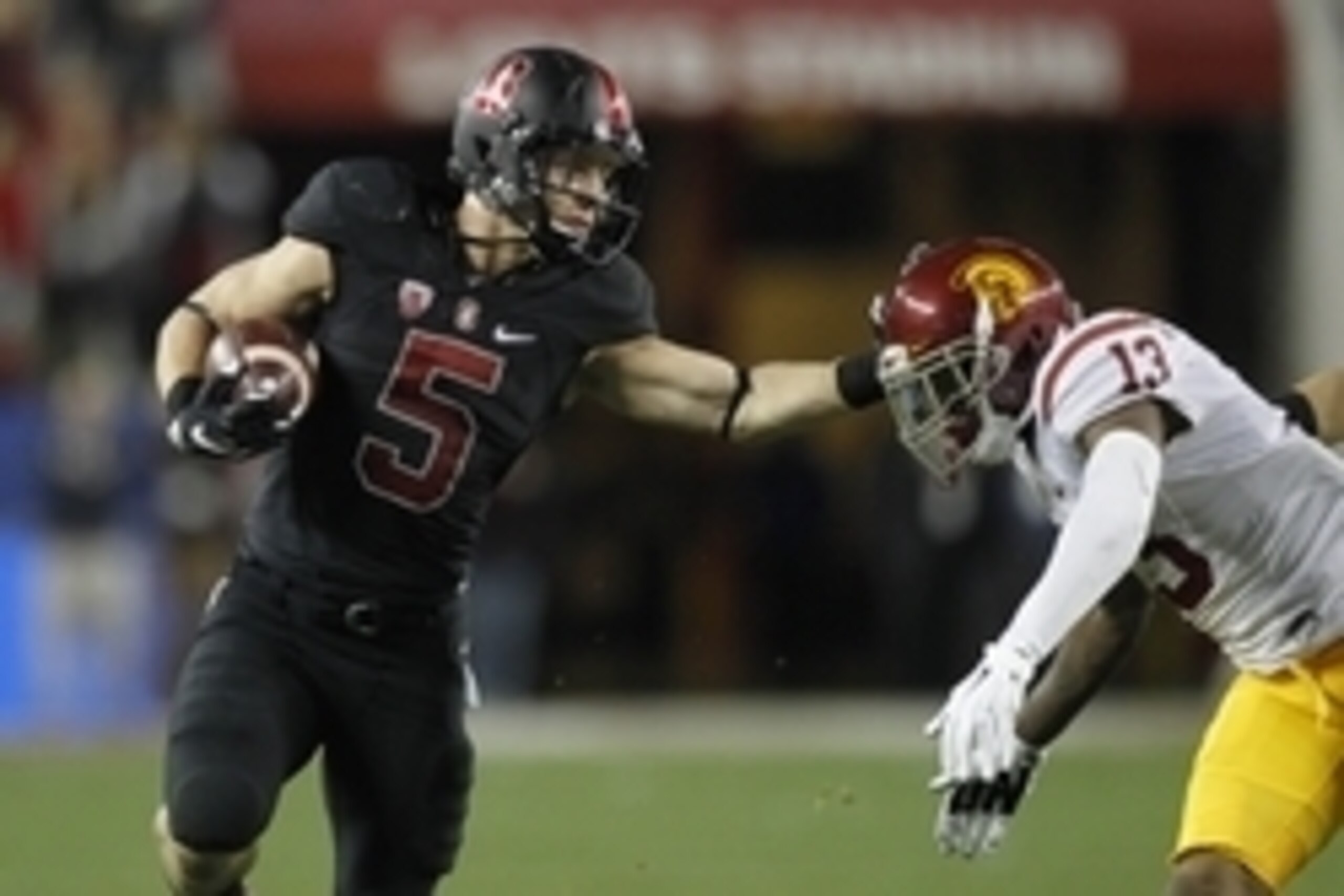 Dec 5, 2015; Santa Clara, CA, USA; Stanford Cardinal running back Christian McCaffrey (5) tries to avoid being tackled by Southern California Trojans cornerback Kevon Seymour (13) after running for a first down in the second quarter in the Pac-12 Conferen Dec 5, 2015; Santa Clara, CA, USA; Stanford Cardinal running back Christian McCaffrey (5) tries to avoid being tackled by Southern California Trojans cornerback Kevon Seymour (13) after running for a first down in the second quarter in the Pac-12 Conferen