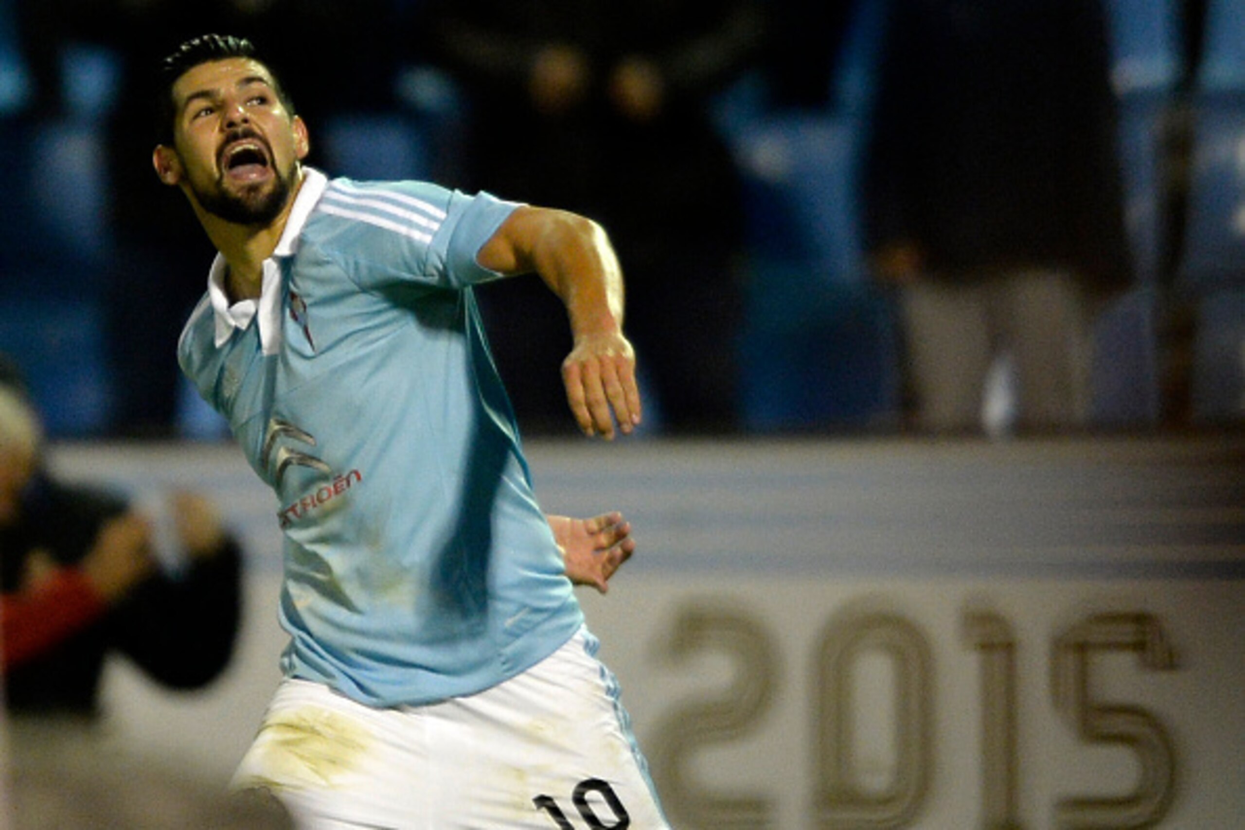Celta Vigo's forward Nolito celebrates after scoring a goal during the Spanish league football match RC Celta de Vigo vs Real Sporting de Gijon at the Balaidos stadium in Vigo on November 28, 2015.   Celta won the match 2-1. AFP PHOTO/ MIGUEL RIOPA / AFP 