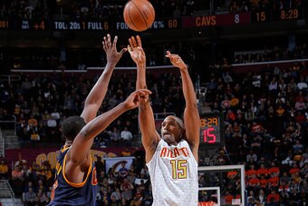 CLEVELAND, OH - NOVEMBER 21: Al Horford #15 of the Atlanta Hawks shoots against Tristan Thompson #13 of the Cleveland Cavaliers on November 21, 2015 at Quicken Loans Arena in Cleveland, Ohio. NOTE TO USER: User expressly acknowledges and agrees that, by d