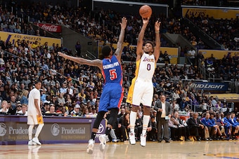 LOS ANGELES, CA - NOVEMBER 15:  Nick Young #0 of the Los Angeles Lakers shoots against Kentavious Caldwell-Pope #5 of the Detroit Pistons on November 15, 2015 at STAPLES Center in Los Angeles, California. NOTE TO USER: User expressly acknowledges and agre