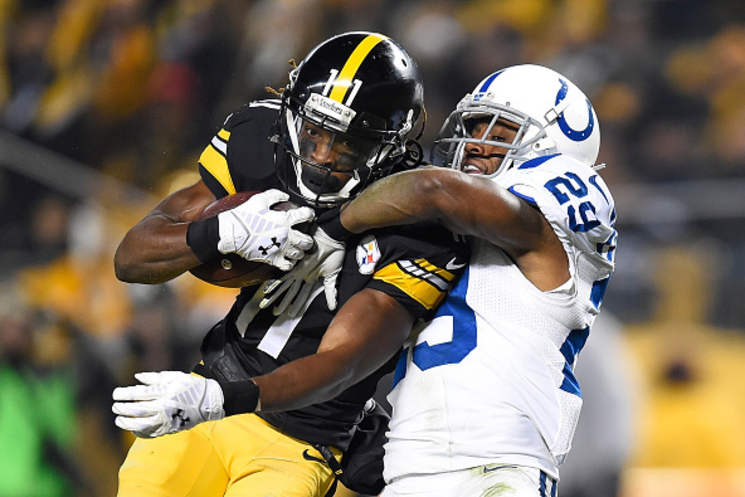 PITTSBURGH, PA - DECEMBER 6:  Mike Adams #29 of the Indianapolis Colts ties up Markus Wheaton #11 of the Pittsburgh Steelers during the second quarter of the game at Heinz Field on December 6, 2015 in Pittsburgh, Pennsylvania. (Photo by Joe Sargent/Getty 