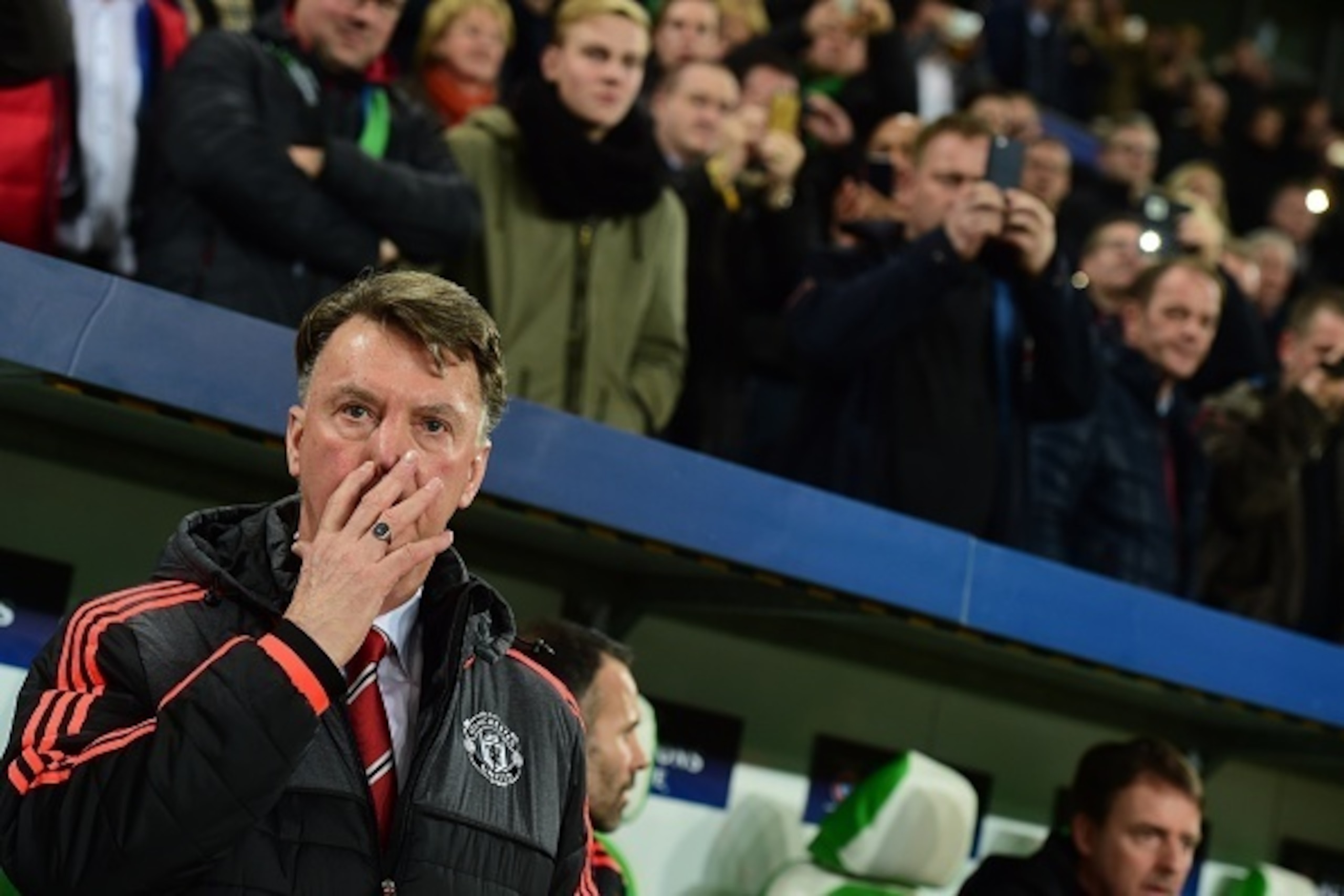 Manchester United's Dutch manager Louis van Gaal is pictured during the UEFA Champions League Group B second-leg football match VfL Wolfsburg vs Manchester United in Wolfsburg, central Germany, on December 8, 2015. AFP PHOTO / JOHN MACDOUGALL / AFP / JOHN