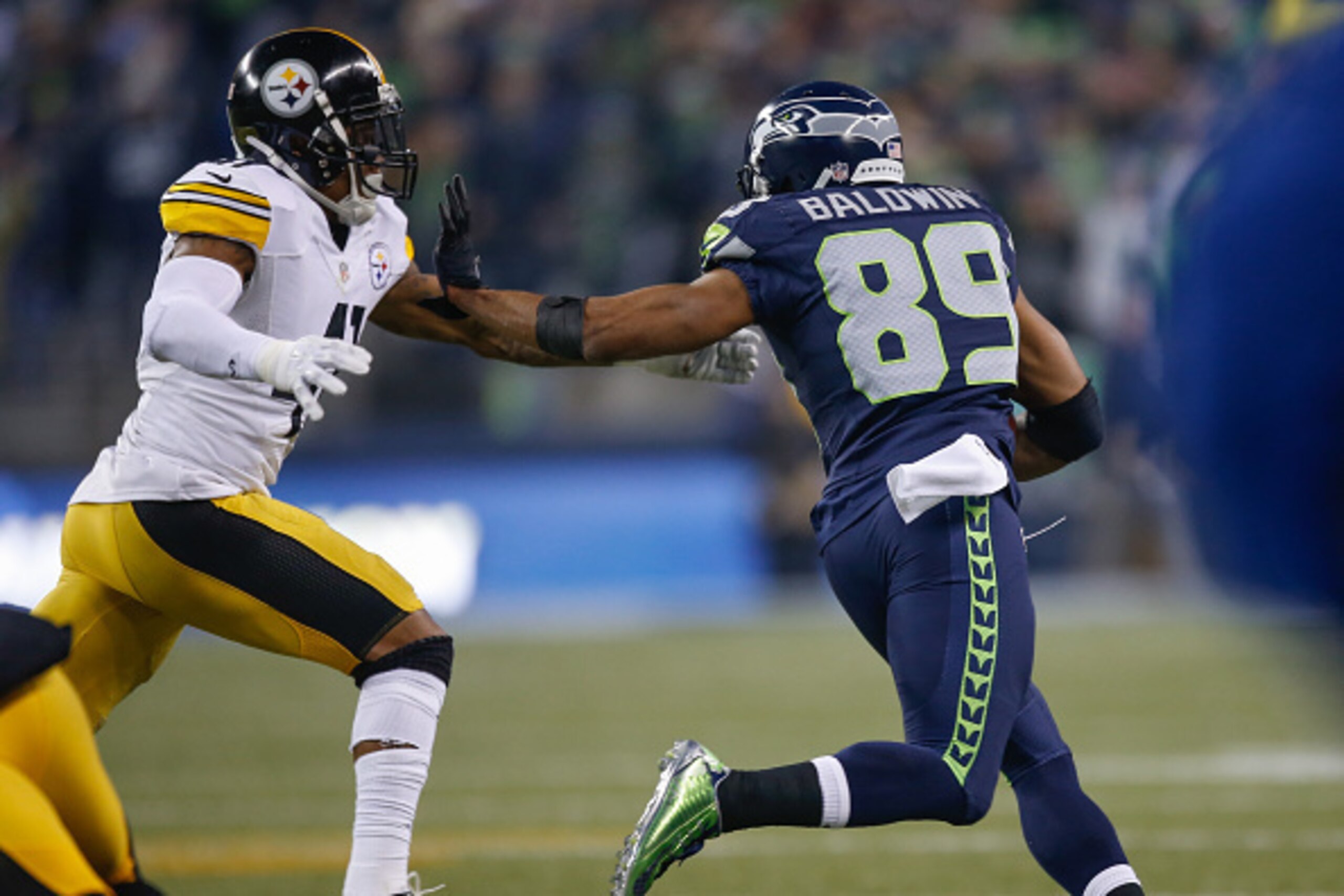 SEATTLE, WA - NOVEMBER 29:  Wide receiver Doug Baldwin #89 of the Seattle Seahawks rushes for a touchdown against defensive back Antwon Blake #41 of the Pittsburgh Steelers in the fourth quarter at CenturyLink Field on November 29, 2015 in Seattle, Washin