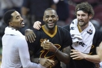 Dec 8, 2015; Cleveland, OH, USA; Cleveland Cavaliers guard J.R. Smith (left), forward LeBron James (center) and forward Kevin Love react after a 105-100 win over the Portland Trail Blazers at Quicken Loans Arena. Mandatory Credit: David Richard-USA TODAY 