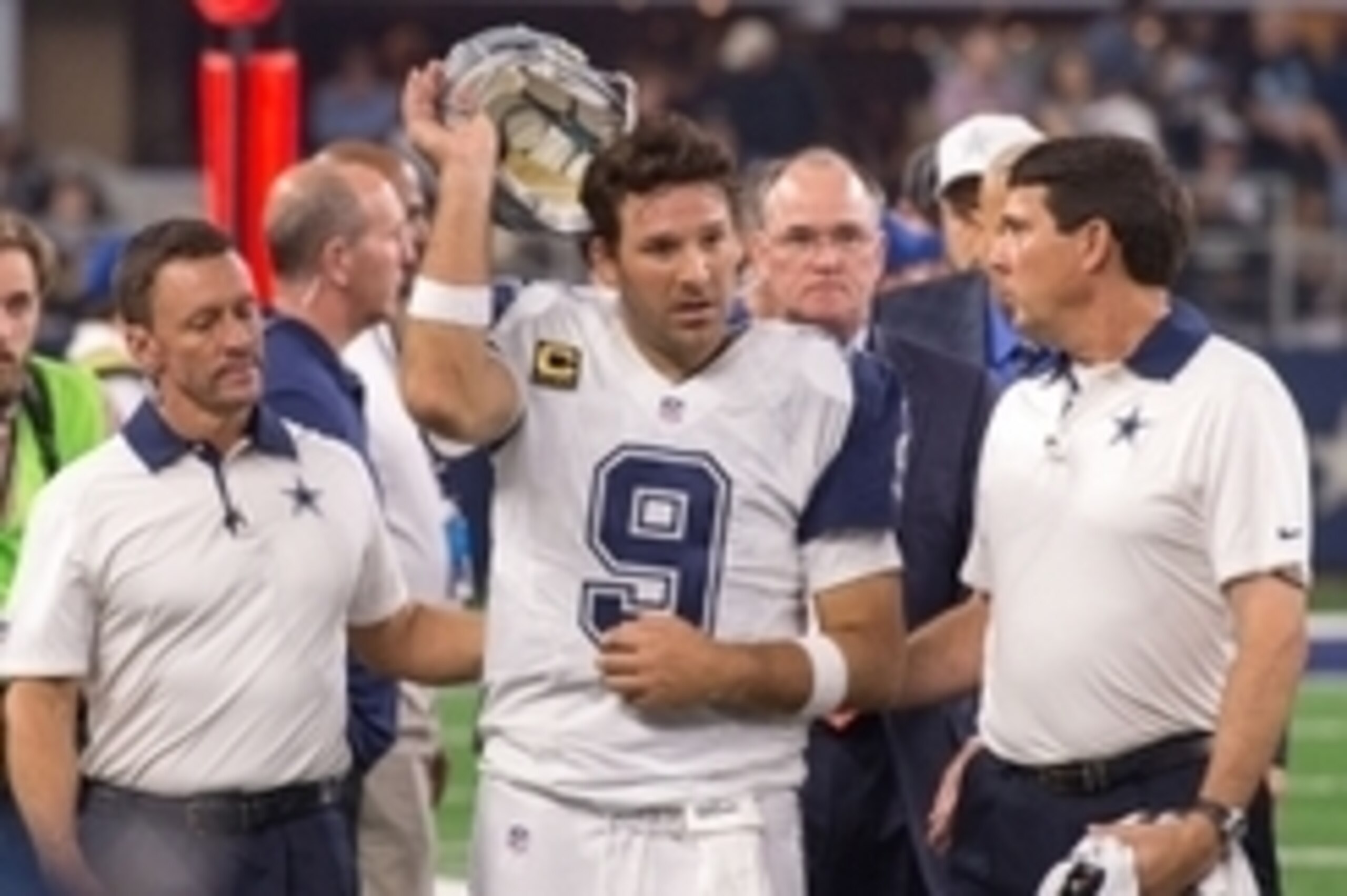 Nov 26, 2015; Arlington, TX, USA; Dallas Cowboys quarterback Tony Romo (9) leaves the field with a season ending injury he suffered during the game against the Carolina Panthers on Thanksgiving at AT&T Stadium. The Panthers defeat the Cowboys 33-14. Manda