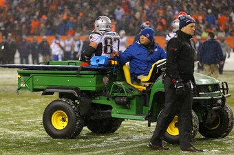 DENVER, CO - NOVEMBER 29: Tight end Rob Gronkowski #87 of the New England Patriots is carted off of the field against the Denver Broncos in the fourth quarter at Sports Authority Field at Mile High on November 29, 2015 in Denver, Colorado. (Photo by Justi