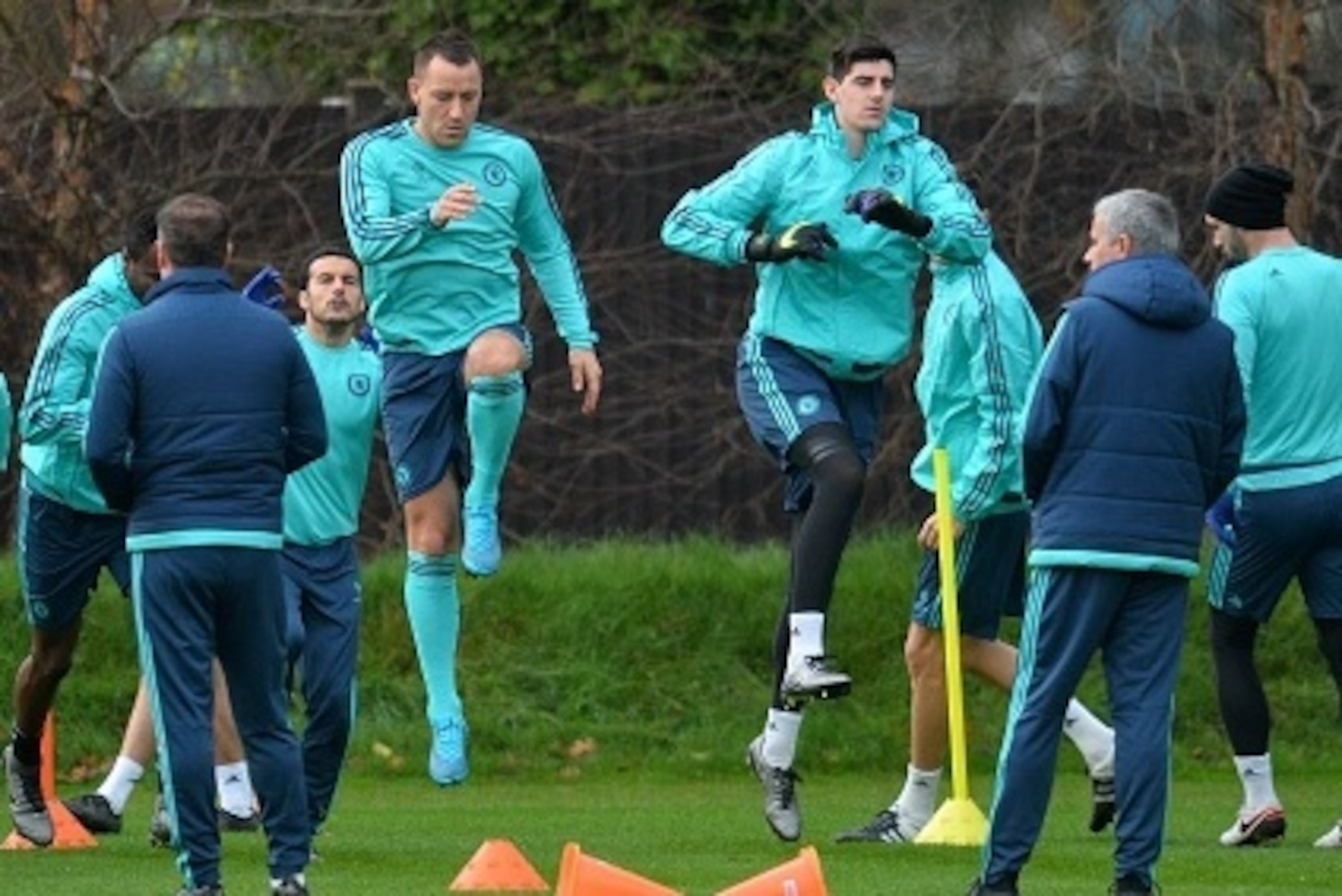 Chelsea's English defender John Terry (C) and Belgian goalkeeper Thibaut Courtois (3R) attend a training session on the eve of a UEFA Champions League, group G football match against Porto at Chelsea's training ground in Cobham, south west London on Decem