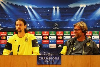 LONDON, ENGLAND - NOVEMBER 25:  Jurgen Klopp manager of Borussia Dortmund (R) and defender Neven Subotic look on during a Borussia Dortmund press conference, ahead of the UEFA Champions League Group D match against Arsenal, at Emirates Stadium on November