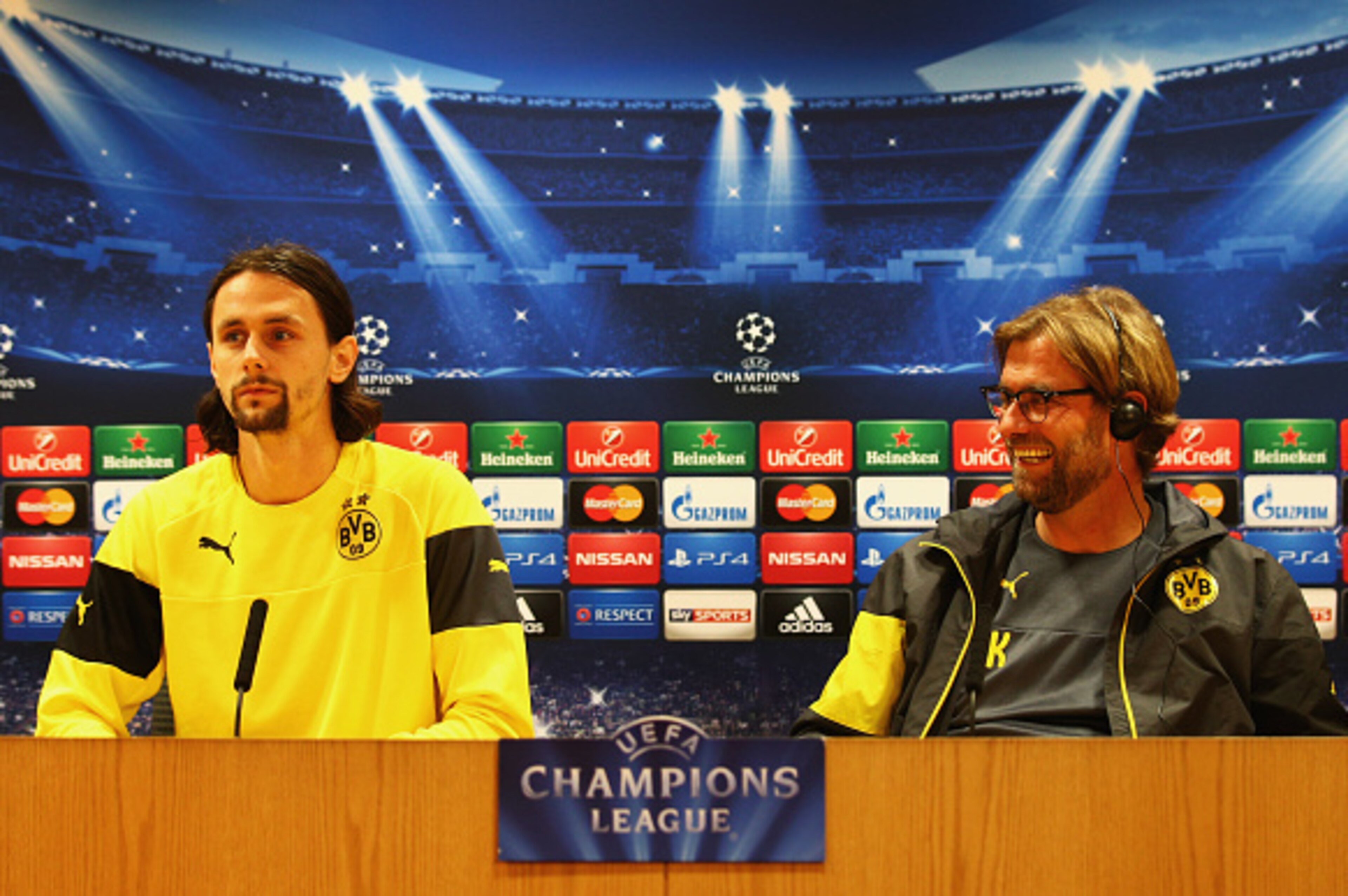 LONDON, ENGLAND - NOVEMBER 25:  Jurgen Klopp manager of Borussia Dortmund (R) and defender Neven Subotic look on during a Borussia Dortmund press conference, ahead of the UEFA Champions League Group D match against Arsenal, at Emirates Stadium on November