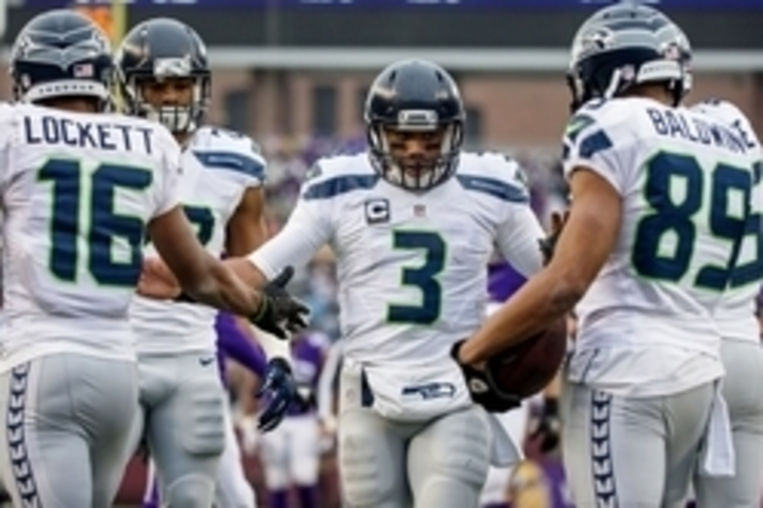 Dec 6, 2015; Minneapolis, MN, USA; Seattle Seahawks quarterback Russell Wilson (3) celebrates with teammates during the third quarter against the Minnesota Vikings at TCF Bank Stadium. The Seahawks defeated the Vikings 38-7. Mandatory Credit: Brace Hemmel