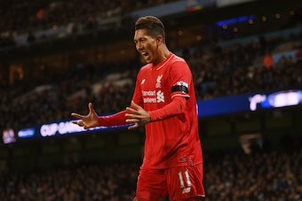 MANCHESTER, ENGLAND - NOVEMBER 21:  Roberto Firmino of Liverpool celebrates his team's first goal scored by Eliaquim Mangala of Manchester City during the Barclays Premier League match between Manchester City and Liverpool at Etihad Stadium on November 21