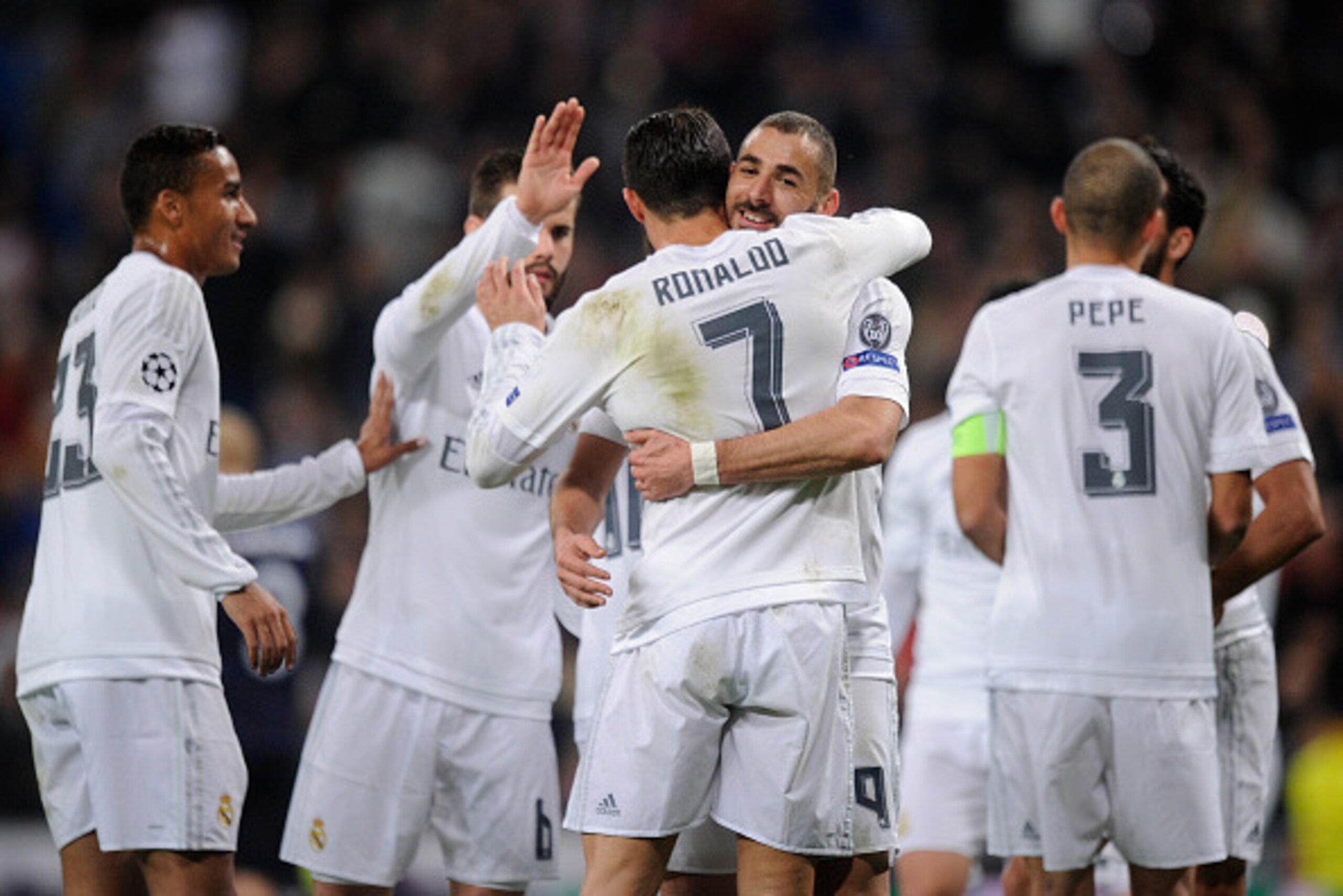 MADRID, SPAIN - DECEMBER 08:  Karim Benzema of Real Madrid celebrates with Cristiano Ronaldo after scoring Real's 2nd goal during the UEFA Champions League Group A match between Real Madrid CF and Malmo FF at the Santiago Bernabeu stadium on December 8, 2