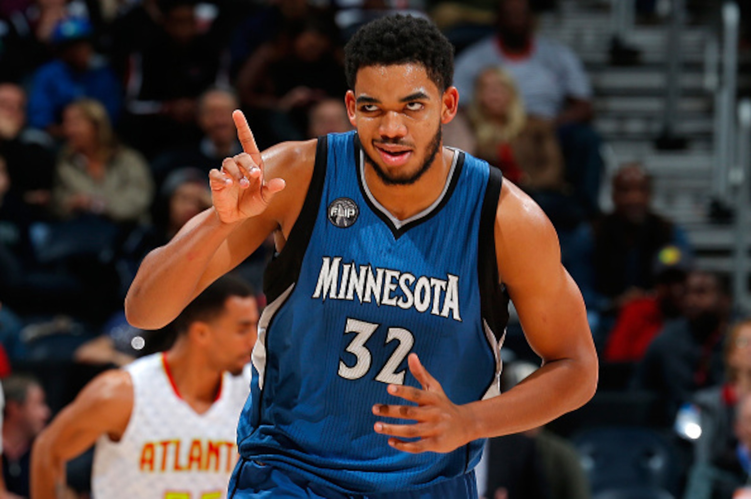 ATLANTA, GA - NOVEMBER 09:  Karl-Anthony Towns #32 of the Minnesota Timberwolves reacts after hitting a basket against the Atlanta Hawks at Philips Arena on November 9, 2015 in Atlanta, Georgia.  NOTE TO USER User expressly acknowledges and agrees that, b