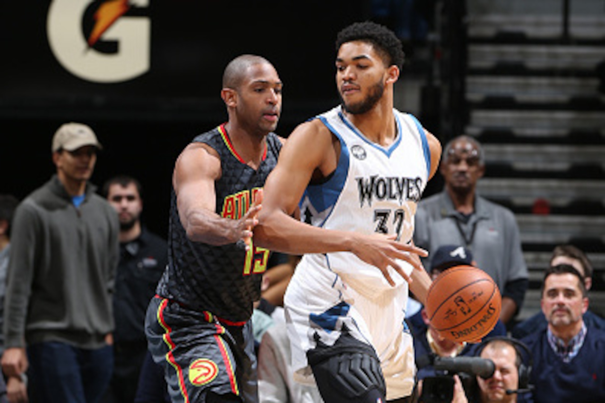 MINNEAPOLIS, MN -  NOVEMBER 25:  Karl-Anthony Towns #32 of the Minnesota Timberwolves posts up against Al Horford #15 of the Atlanta Hawks on November 25, 2015 at Target Center in Minneapolis, Minnesota. NOTE TO USER: User expressly acknowledges and agree