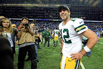 DETROIT, MI - DECEMBER 3: Quarterback Aaron Rodgers #12 of the Green Bay Packers celebrates after throwing the game winning touchdown pass with time expired to defeat the Detroit Lions 27-23 at Ford Field on December 3, 2015 in Detroit, Michigan. (Photo b
