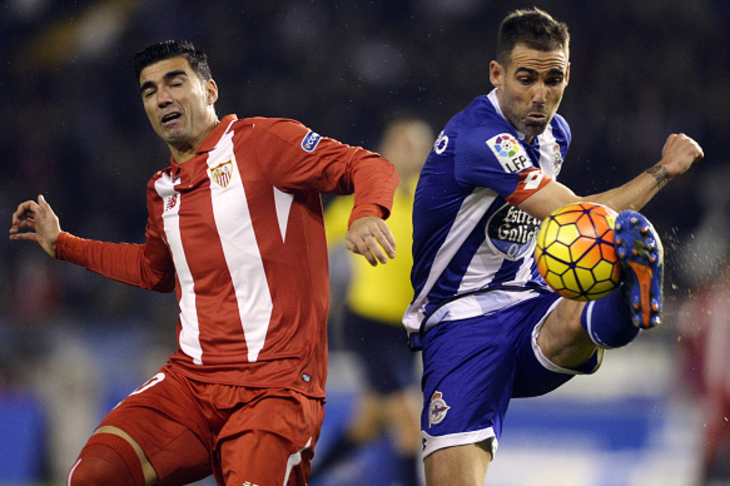 Sevilla's Spanish forward Jose Antonio Reyes (L) vies with Deportivo La Coruna's defender Fernando Navarro during the Spanish league football match RC Deportivo de la Coruna vs Sevilla FC at the Municipal de Riazor stadium in La Coruna on December 5, 2015 Sevilla's Spanish forward Jose Antonio Reyes (L) vies with Deportivo La Coruna's defender Fernando Navarro during the Spanish league football match RC Deportivo de la Coruna vs Sevilla FC at the Municipal de Riazor stadium in La Coruna on December 5, 2015