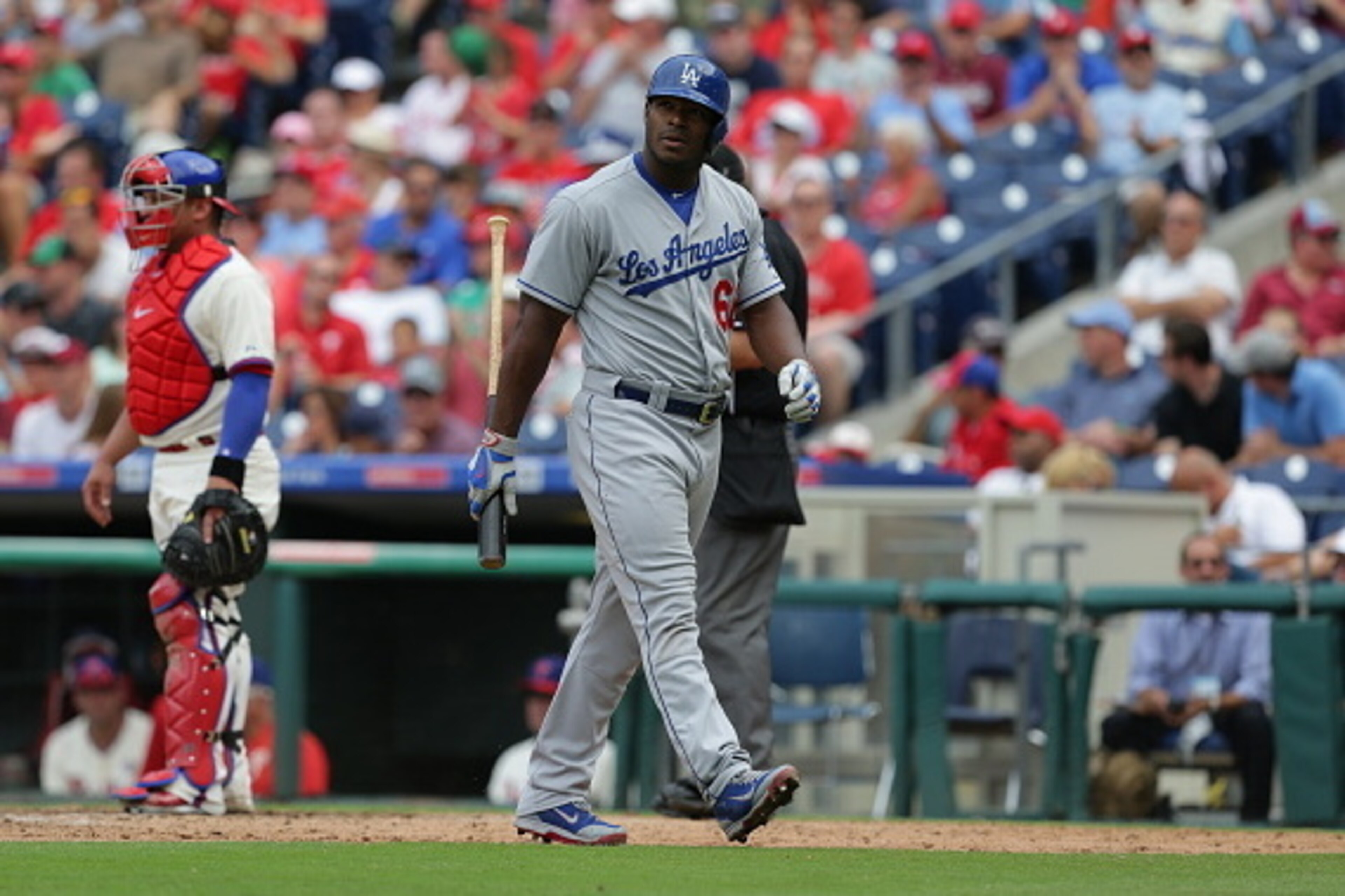 PHILADELPHIA, PA - AUGUST 6: Yasiel Puig #66 of the Los Angeles Dodgers walks back to the dugout after striking out during a game against the Philadelphia Phillies at Citizens Bank Park on August 6, 2015 in Philadelphia, Pennsylvania. The Dodgers won 10-8