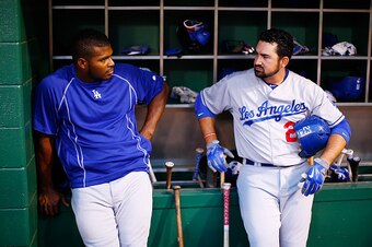 PITTSBURGH, PA - AUGUST 09:  Yasiel Puig #66 and Adrian Gonzalez #23 of the Los Angeles Dodgers in action against the Pittsburgh Pirates during the game at PNC Park on August 9, 2015 in Pittsburgh, Pennsylvania.  (Photo by Jared Wickerham/Getty Images)