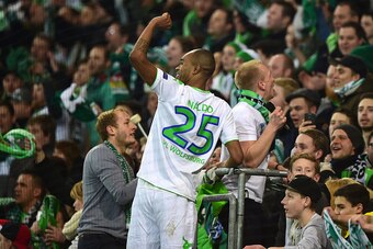 Wolfsburg's Brazilian defender Naldo celebrates with fans after the UEFA Champions League Group B second-leg football match VfL Wolfsburg vs Manchester United in Wolfsburg, central Germany, on December 8, 2015. Manchester United crashed out of the Champio