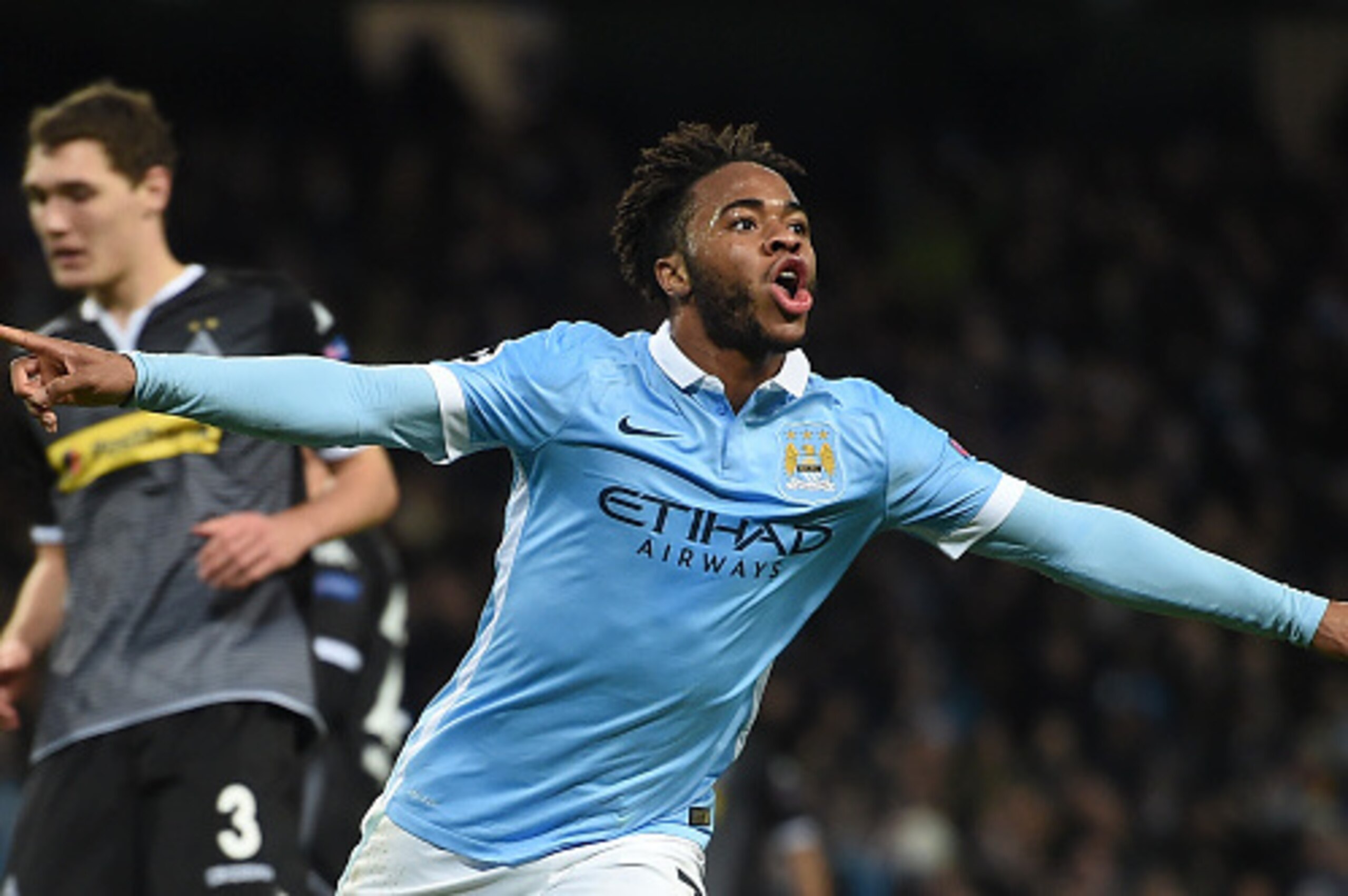 Manchester City's English midfielder Raheem Sterling celebrates scoring his second and City's third goal to take the lead 3-2 during the UEFA Champions League Group D football match between Manchester City and Borussia Moenchengladbach at the Etihad Stadi