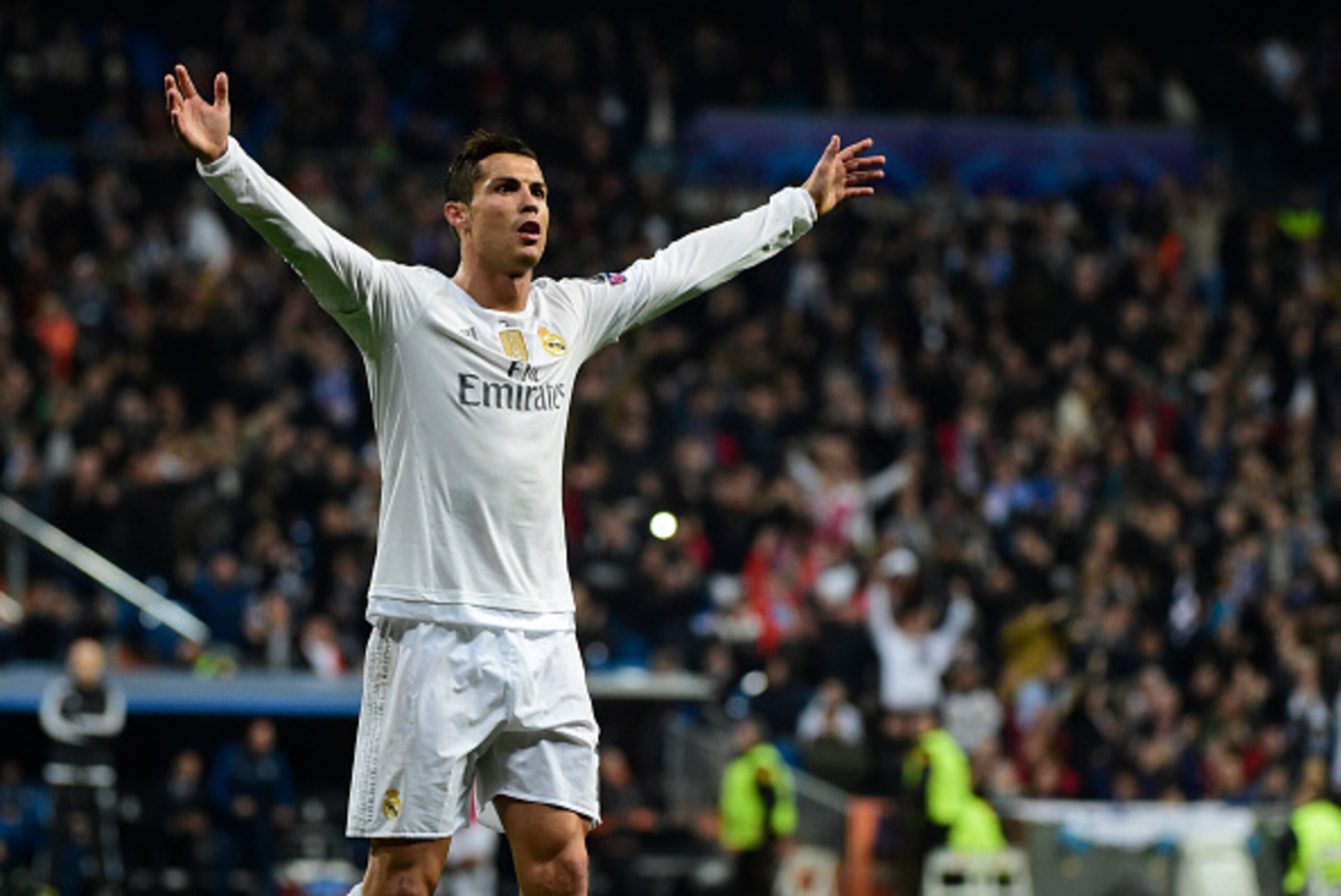 Real Madrid's Portuguese forward Cristiano Ronaldo celebrates after scoring during the UEFA Champions League Group A football match Real Madrid CF vs Malmo FF at the Santiago Bernabeu stadium in Madrid on December 8, 2015.   AFP PHOTO/ PIERRE-PHILIPPE MAR