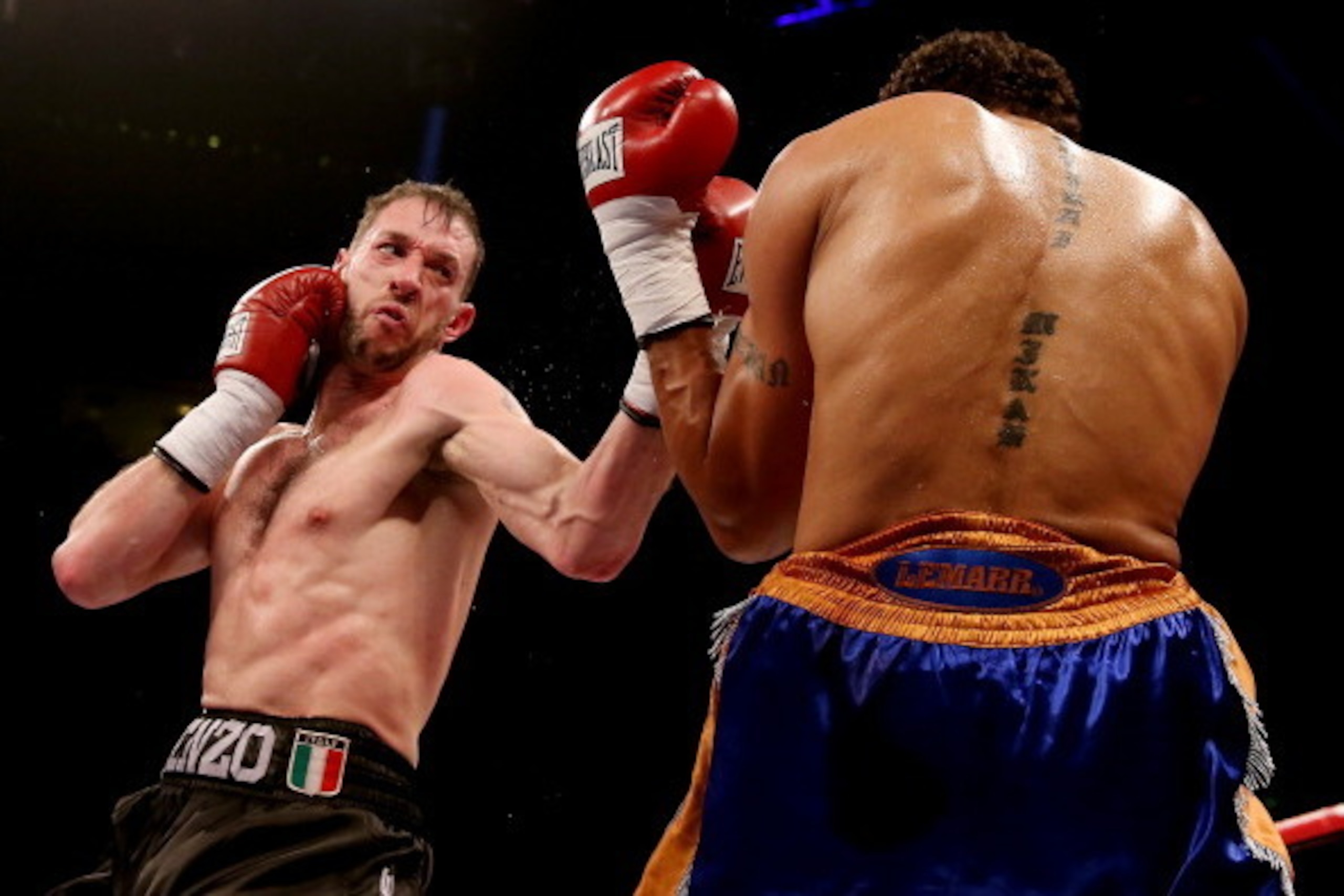 LIVERPOOL, ENGLAND - DECEMBER 07:  Enzo Maccarinelli (L) in action with Courtney Fry during their Commonwealth light Heavyweight bout at Liverpool Echo Arena on December 7, 2013 in Liverpool, England.  (Photo by Scott Heavey/Getty Images)