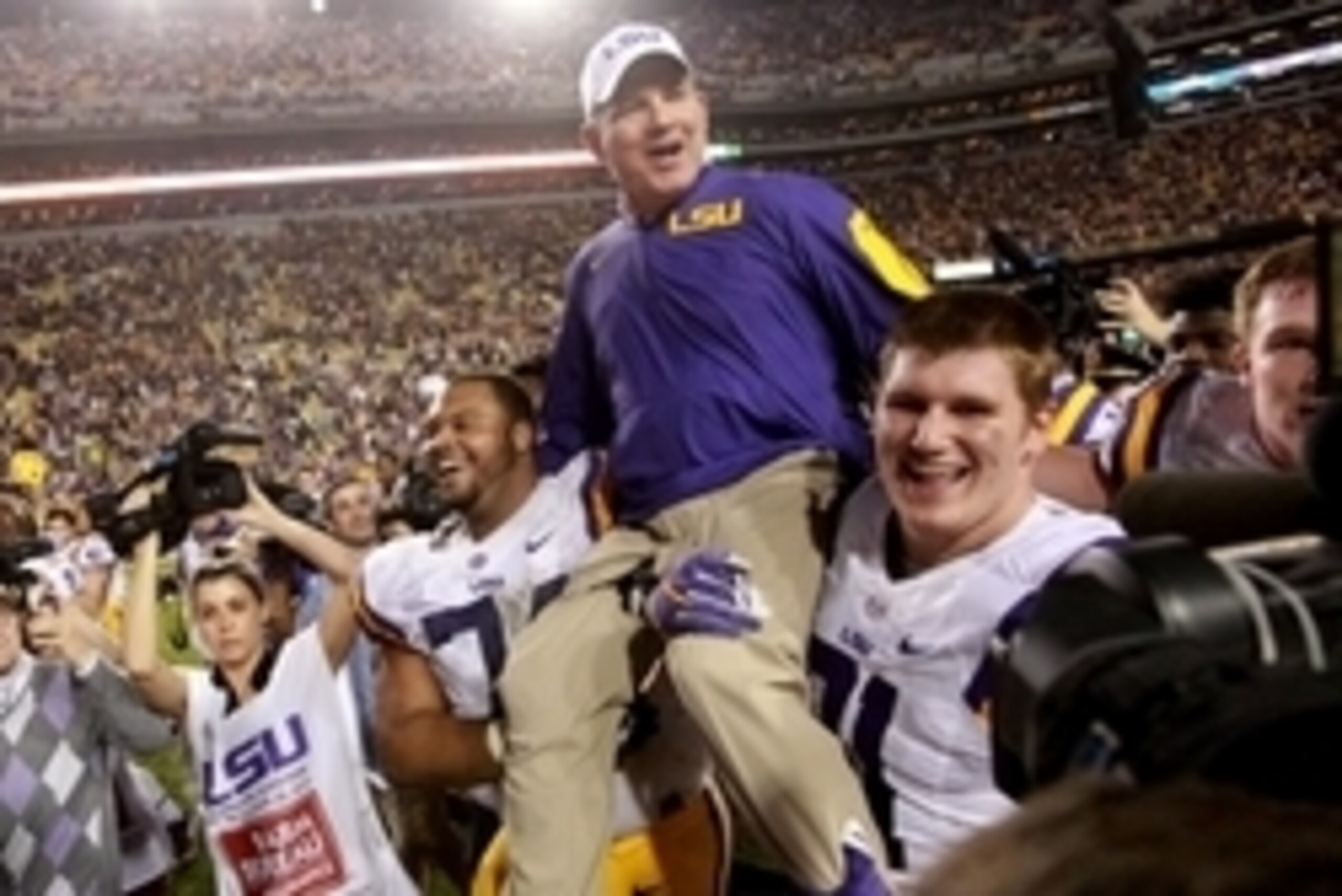 Nov 28, 2015; Baton Rouge, LA, USA; LSU Tigers head coach Les Miles is picked up by his players after defeating the Texas A&M Aggies 19-7 at Tiger Stadium. Mandatory Credit: Crystal LoGiudice-USA TODAY Sports