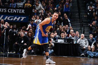 BROOKLYN, NY - DECEMBER 6: Stephen Curry #30 of the Golden State Warriors cheers during the game against the Brooklyn Nets on December 6, 2015 at Barclays Center in Brooklyn, New York. NOTE TO USER: User expressly acknowledges and agrees that, by download