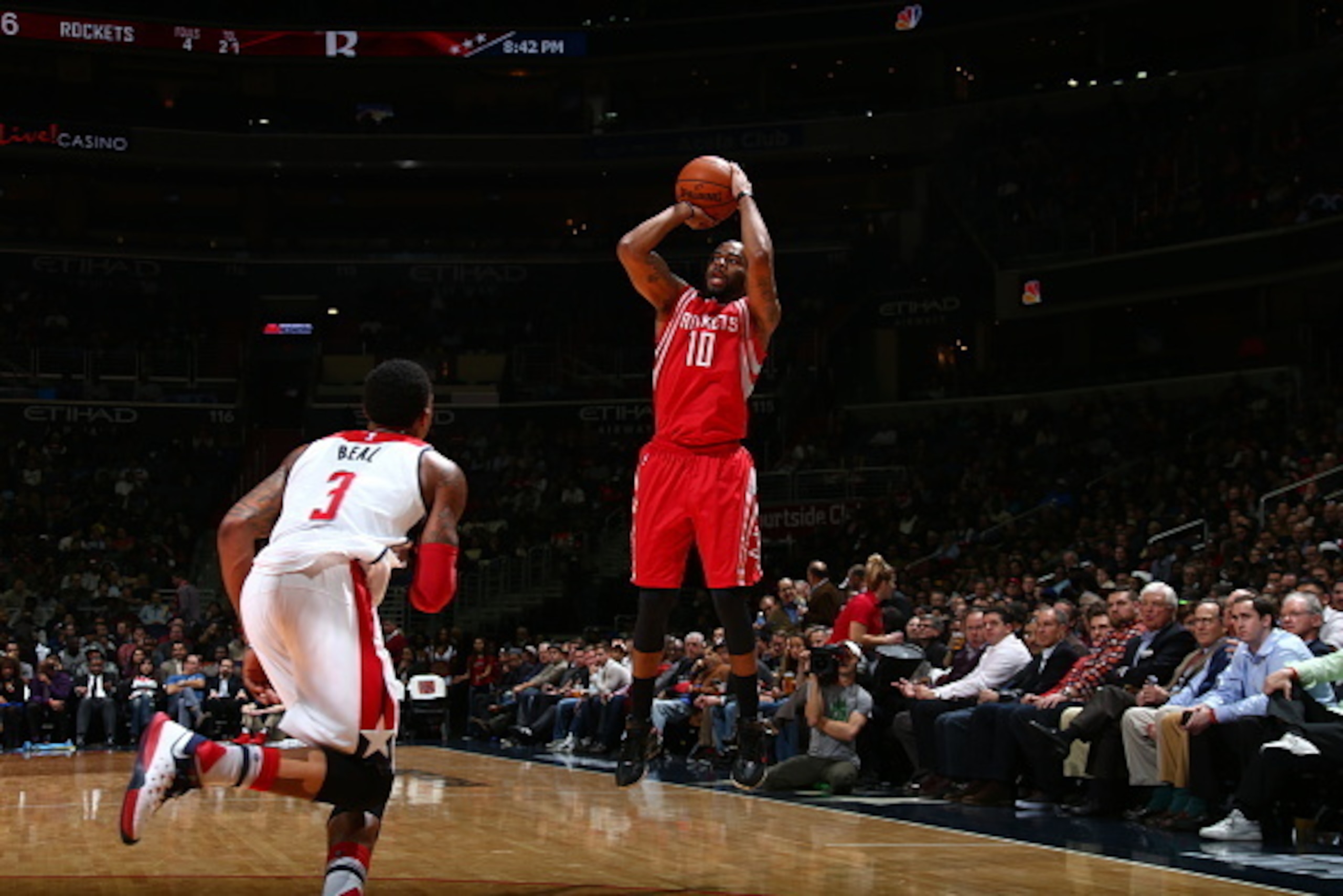 WASHINGTON, DC -  DECEMBER 9:  Marcus Thornton #10 of the Houston Rockets shoots against Bradley Beal #3 of the Washington Wizards on December 9, 2015 at Verizon Center in Washington, DC. NOTE TO USER: User expressly acknowledges and agrees that, by downl