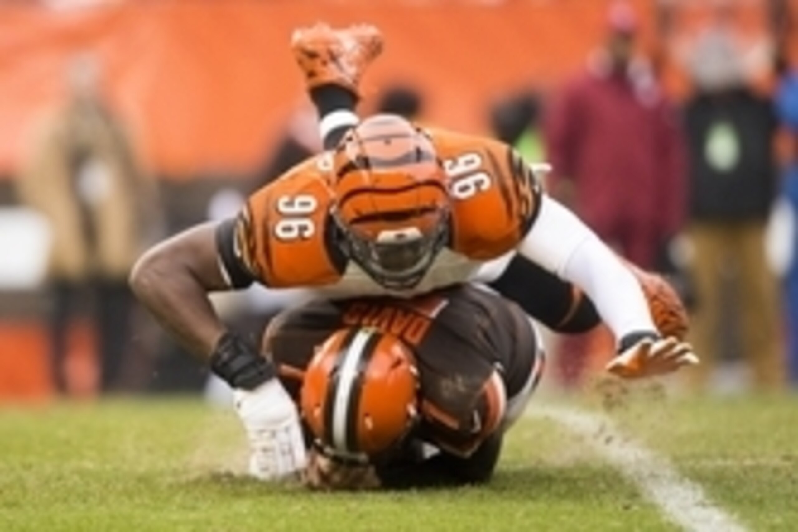 Dec 6, 2015; Cleveland, OH, USA; Cincinnati Bengals defensive end Carlos Dunlap (96) sacks Cleveland Browns quarterback Austin Davis (7) during the third quarter at FirstEnergy Stadium. The Bengals defeated the Browns 37-3. Mandatory Credit: Scott R. Galv