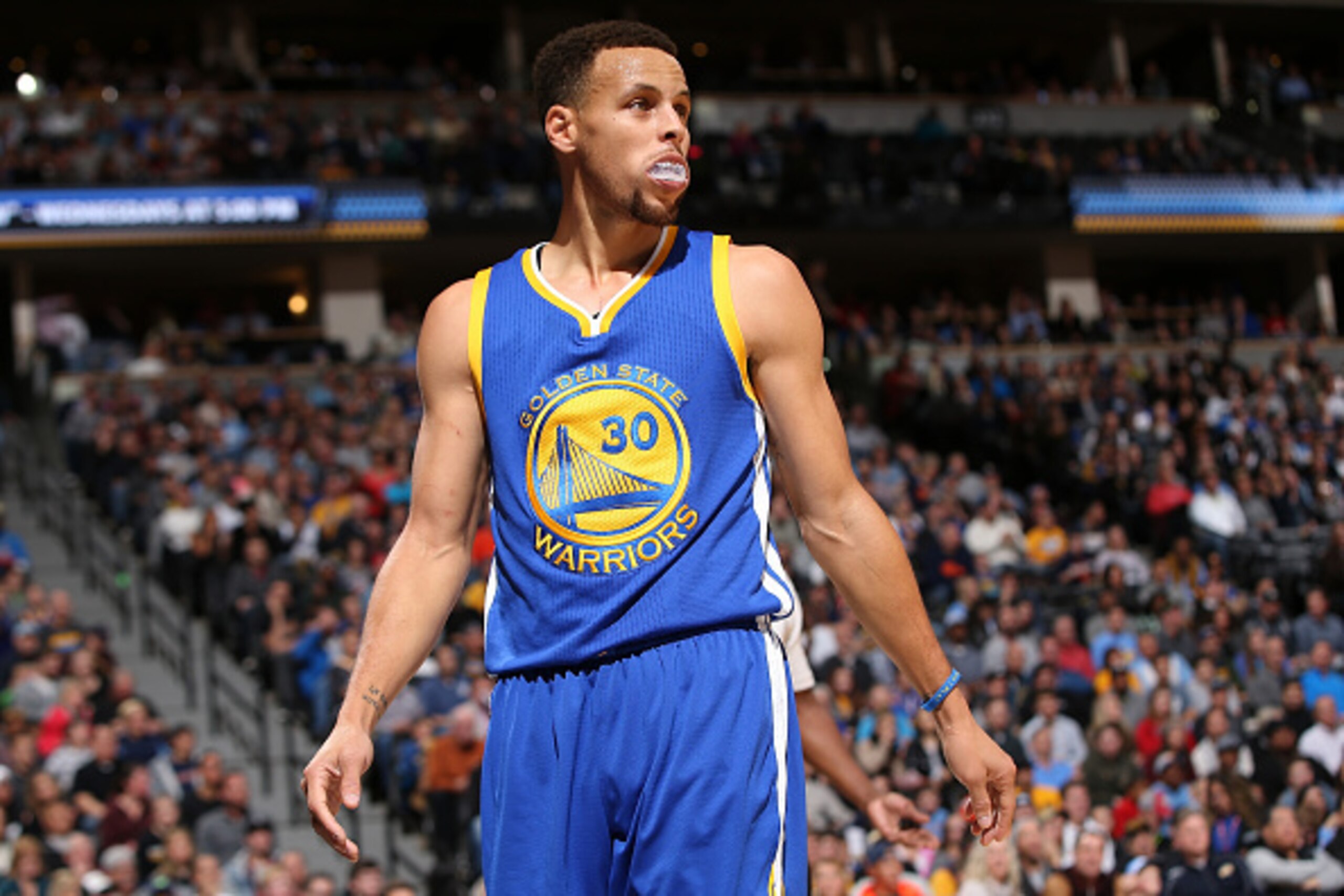 DENVER, CO - NOVEMBER 22:  Stephen Curry #30 of the Golden State Warriors takes the court against the Denver Nuggets at Pepsi Center on November 22, 2015 in Denver, Colorado. The Warriors defeated the Nuggets 118-105 to start the season 15-0. NOTE TO USER