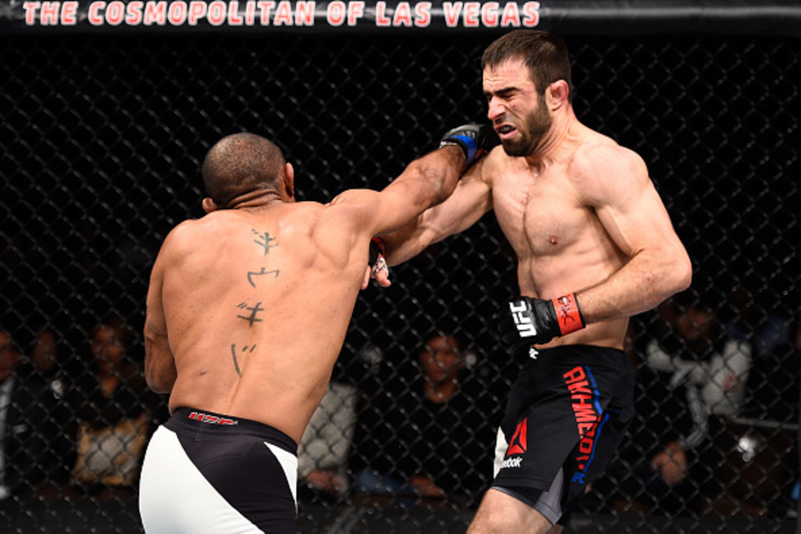 LAS VEGAS, NEVADA - DECEMBER 10:  (R) Sergio Moraes punches Omari Akhmedov in their welterweight bout during the UFC Fight Night event at The Chelsea at the Cosmopolitan of Las Vegas on December 10, 2015 in Las Vegas, Nevada.  (Photo by Jeff Bottari/Zuffa