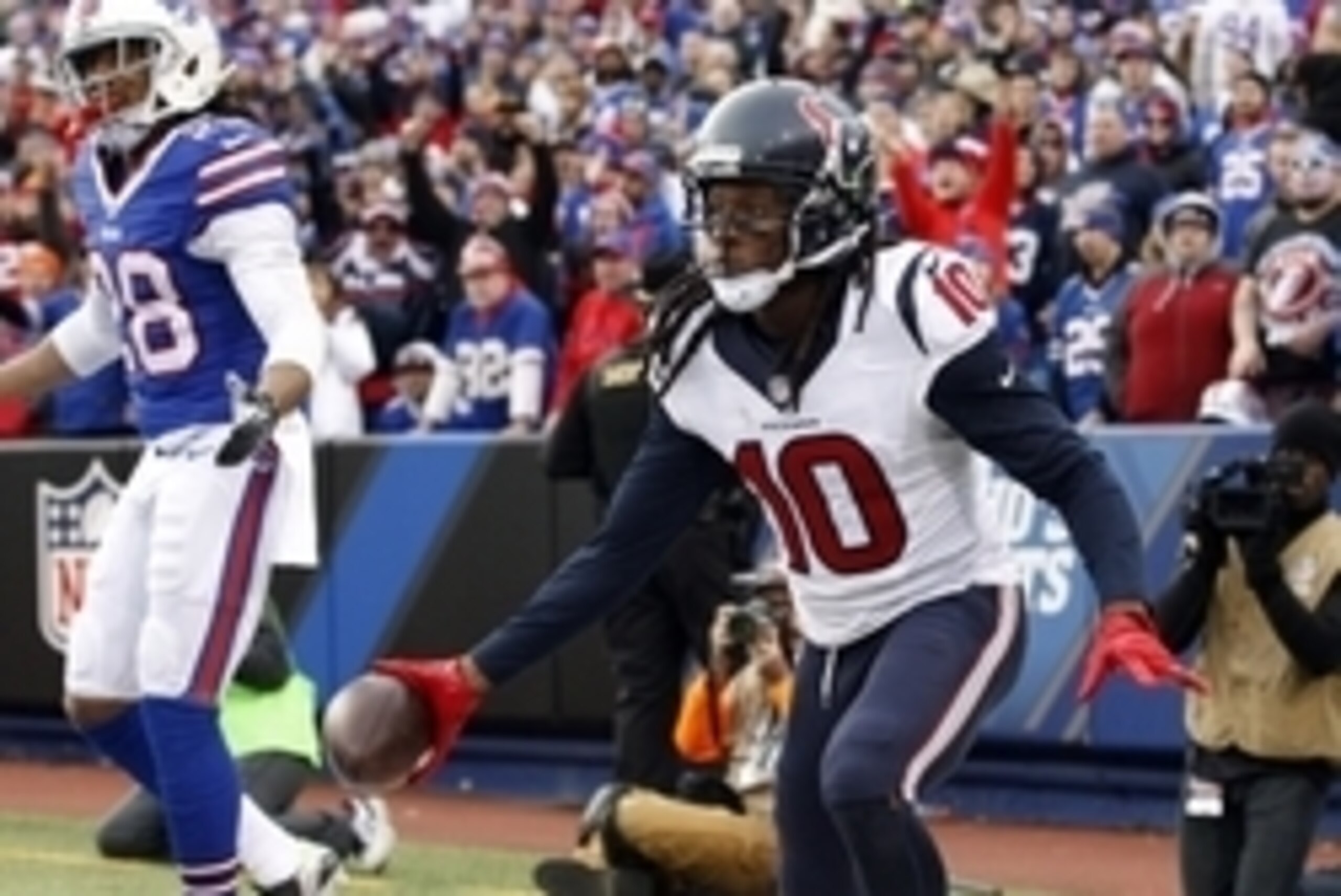 Dec 6, 2015; Orchard Park, NY, USA; Houston Texans wide receiver DeAndre Hopkins (10) celebrates his touchdown catch as Buffalo Bills cornerback Ronald Darby (28) looks on during the second half at Ralph Wilson Stadium. Bills beat the Texans 30-21. Mandat