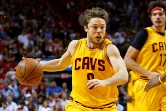 MIAMI, FL - DECEMBER 14: Matthew Dellavedova #9 of the Cleveland Cavaliers drives to the basket during a game against the Miami Heat at American Airlines Arena on December 14, 2013 in Miami, Florida. NOTE TO USER: User expressly acknowledges and agrees th