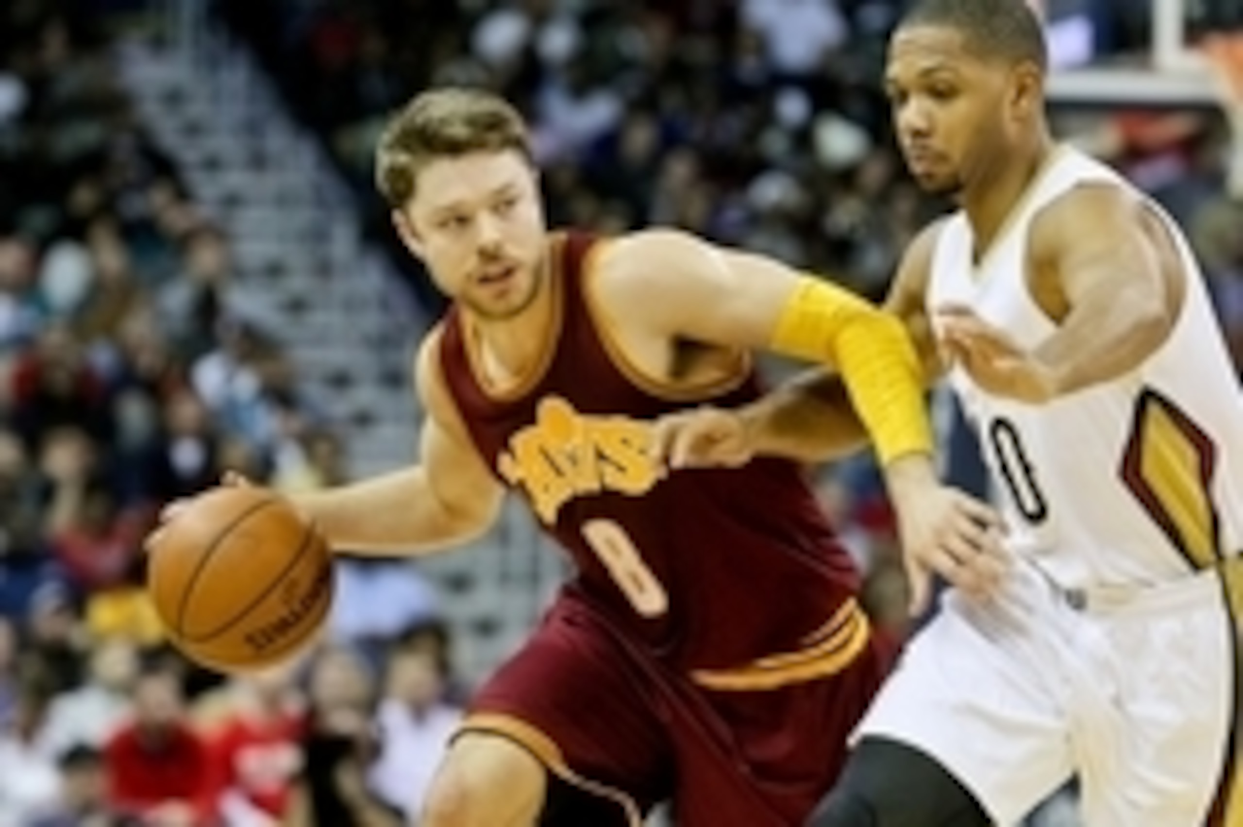 Dec 4, 2015; New Orleans, LA, USA; Cleveland Cavaliers guard Matthew Dellavedova (8) drives past New Orleans Pelicans guard Eric Gordon (10) during the first half of a game at the Smoothie King Center. Mandatory Credit: Derick E. Hingle-USA TODAY Sports