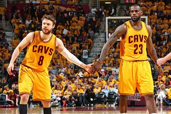 CLEVELAND, OH - MAY 24:  LeBron James #23 shakes hands with Matthew Dellavedova #8 of the Cleveland Cavaliers in Game Three of the Eastern Conference Finals against the Atlanta Hawks during the 2015 NBA Playoffs on May 24, 2015 at Quicken Loans Arena in C
