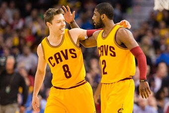 CLEVELAND, OH - MARCH 18:  Matthew Dellavedova #8 of the Cleveland Cavaliers celebrates with Kyrie Irving #2 after Irving scored during the first half against the Brooklyn Nets at Quicken Loans Arena on March 18, 2015 in Cleveland, Ohio. NOTE TO USER: Use