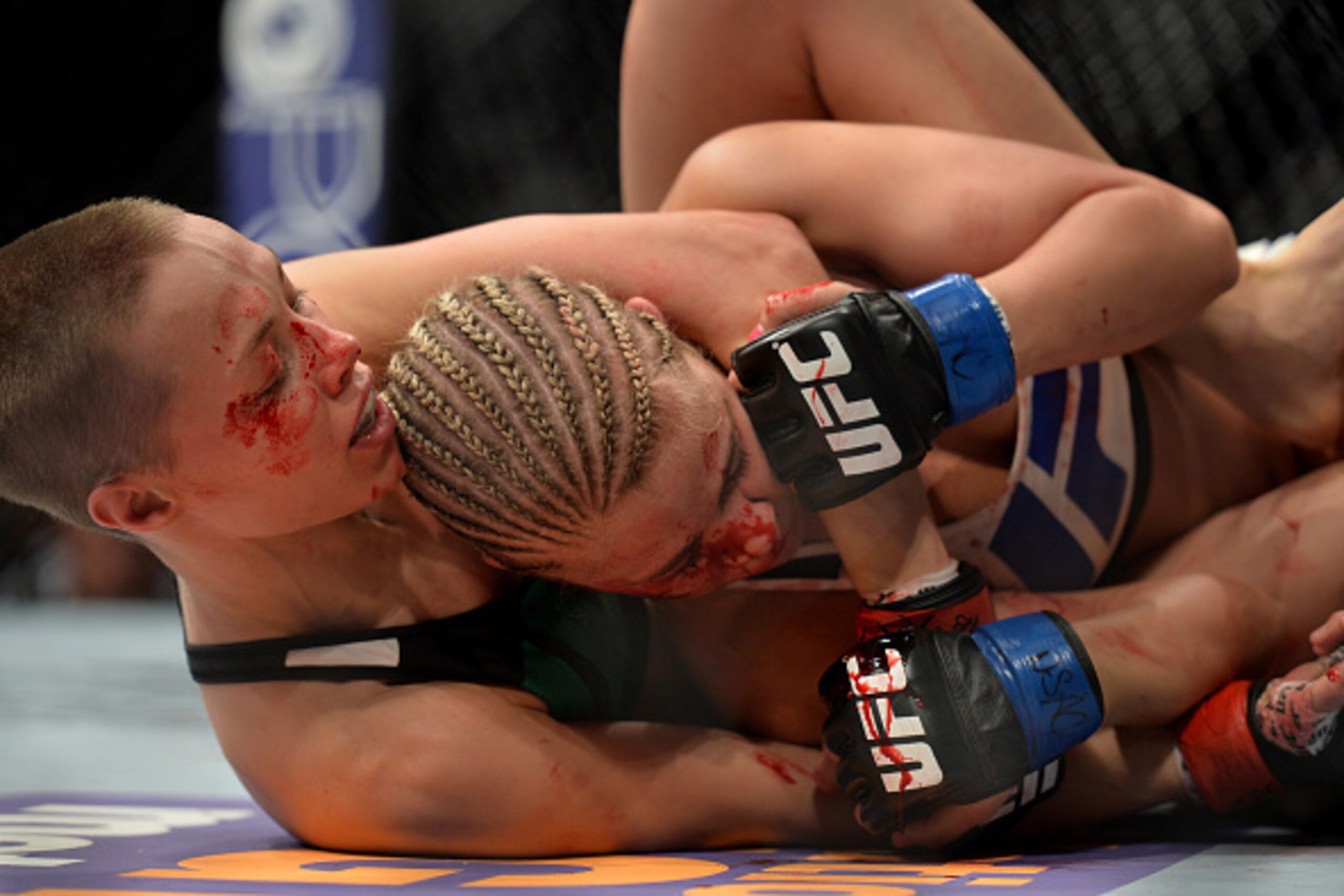 LAS VEGAS, NEVADA - DECEMBER 10:  (L) Rose Namajunas attempts a submission on Paige VanZant in their women's strawweight bout during the UFC Fight Night event at The Chelsea at the Cosmopolitan of Las Vegas on December 10, 2015 in Las Vegas, Nevada.  (Pho