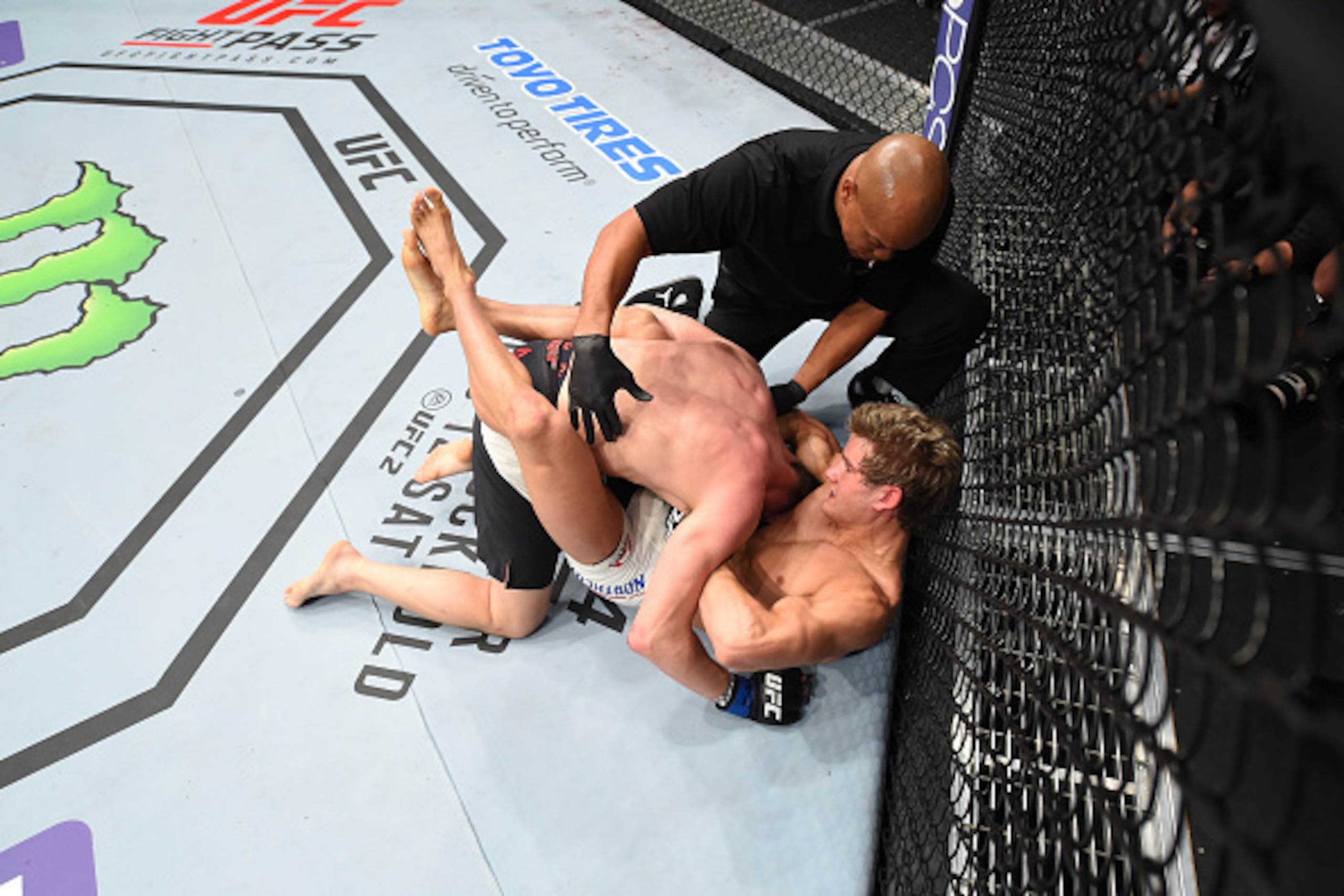 LAS VEGAS, NEVADA - DECEMBER 10:  (Bottom) Sage Northcutt wins by submission over Cody Pfister in their lightweight bout during the UFC Fight Night event at The Chelsea at the Cosmopolitan of Las Vegas on December 10, 2015 in Las Vegas, Nevada.  (Photo by