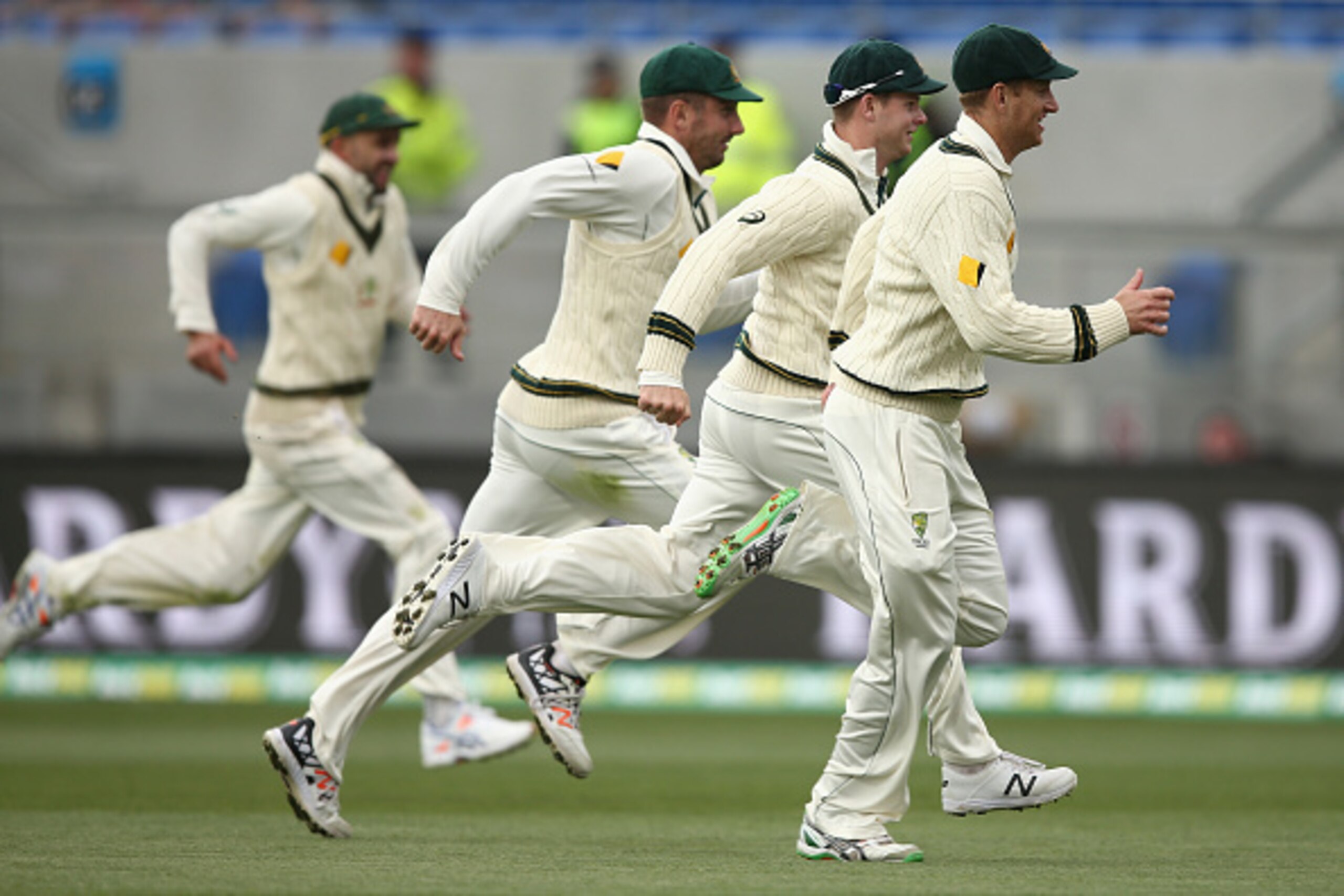 HOBART, AUSTRALIA - DECEMBER 11: Adam Voges, Steve Smith, Shaun Marsh and Nathan Lyon of Australia chase the ball during day two of the First Test match between Australia and the West Indies at Blundstone Arena on December 11, 2015 in Hobart, Australia.  