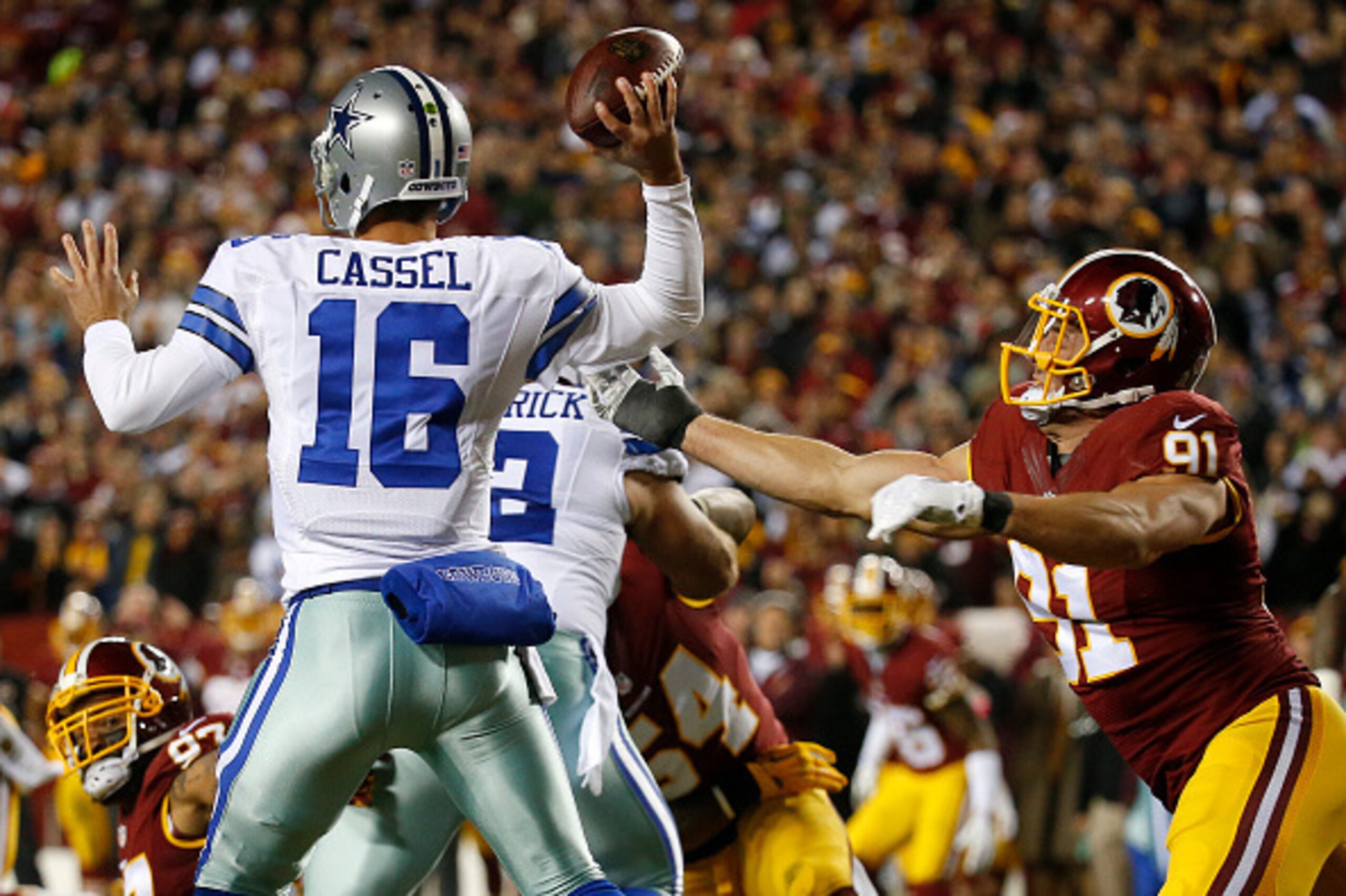 LANDOVER, MD - DECEMBER 7:  Quarterback Matt Cassel #16 of the Dallas Cowboys passes the ball while under pressure form outside linebacker Ryan Kerrigan #91 of the Washington Redskins in the first quarter at FedExField on December 7, 2015 in Landover, Mar