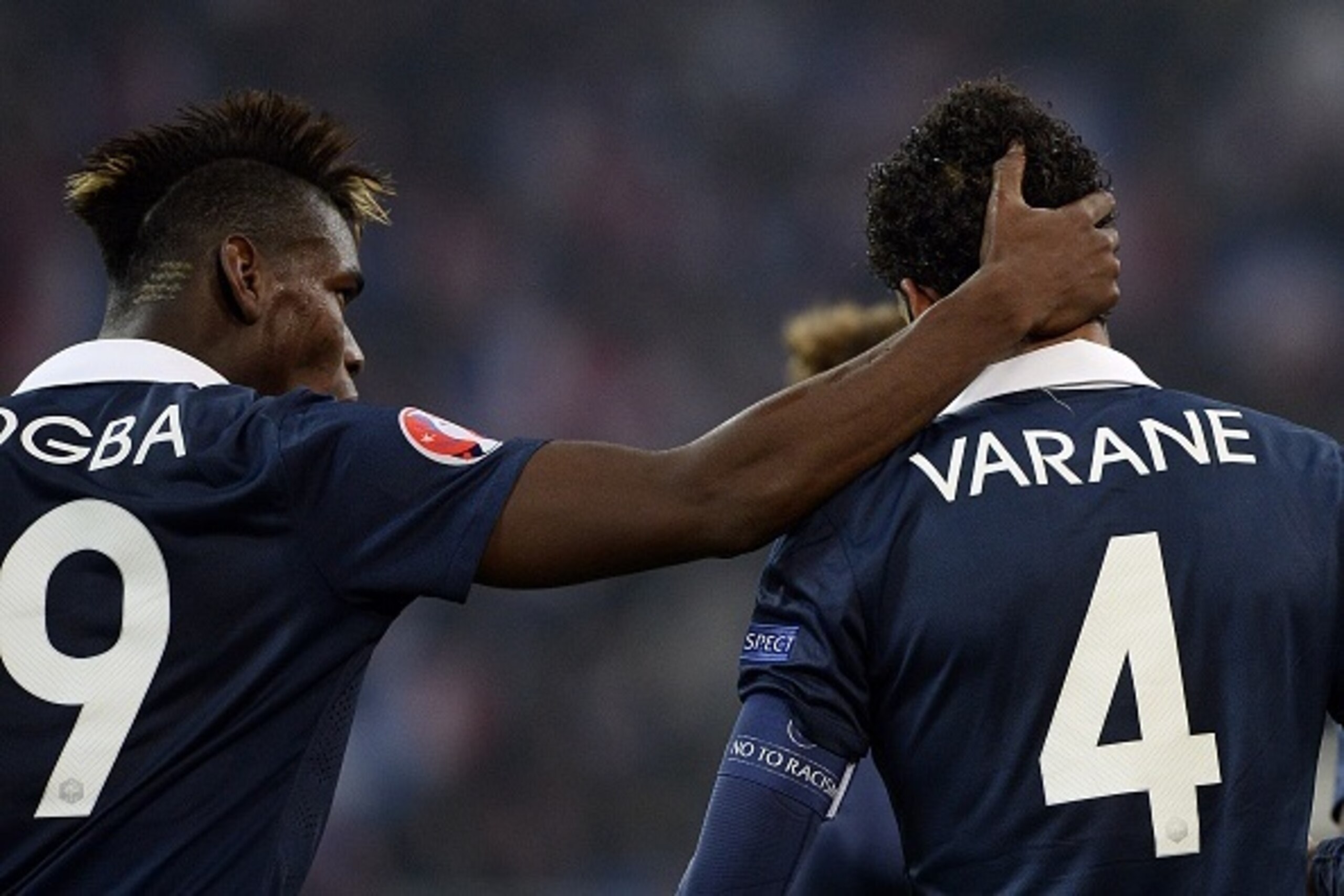 French defender Raphael Varane is congratulated by French midfielder Paul Pogba after scoring a goal during the friendly football match France vs Sweden on November 17, 2014 at the Velodrome stadium in Marseille, southern France. AFP PHOTO / FRANCK FIFE French defender Raphael Varane is congratulated by French midfielder Paul Pogba after scoring a goal during the friendly football match France vs Sweden on November 17, 2014 at the Velodrome stadium in Marseille, southern France. AFP PHOTO / FRANCK FIFE