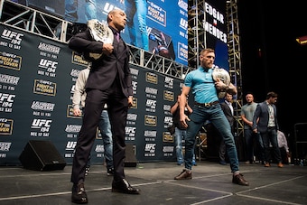 LAS VEGAS, NV - DECEMBER 09:  (L-R) UFC featherweight champion Jose Aldo and UFC interim featherweight champion Conor McGregor of Ireland face off during the UFC Press Conference inside MGM Grand Garden Arena on December 9, 2015 in Las Vegas, Nevada.  (Ph